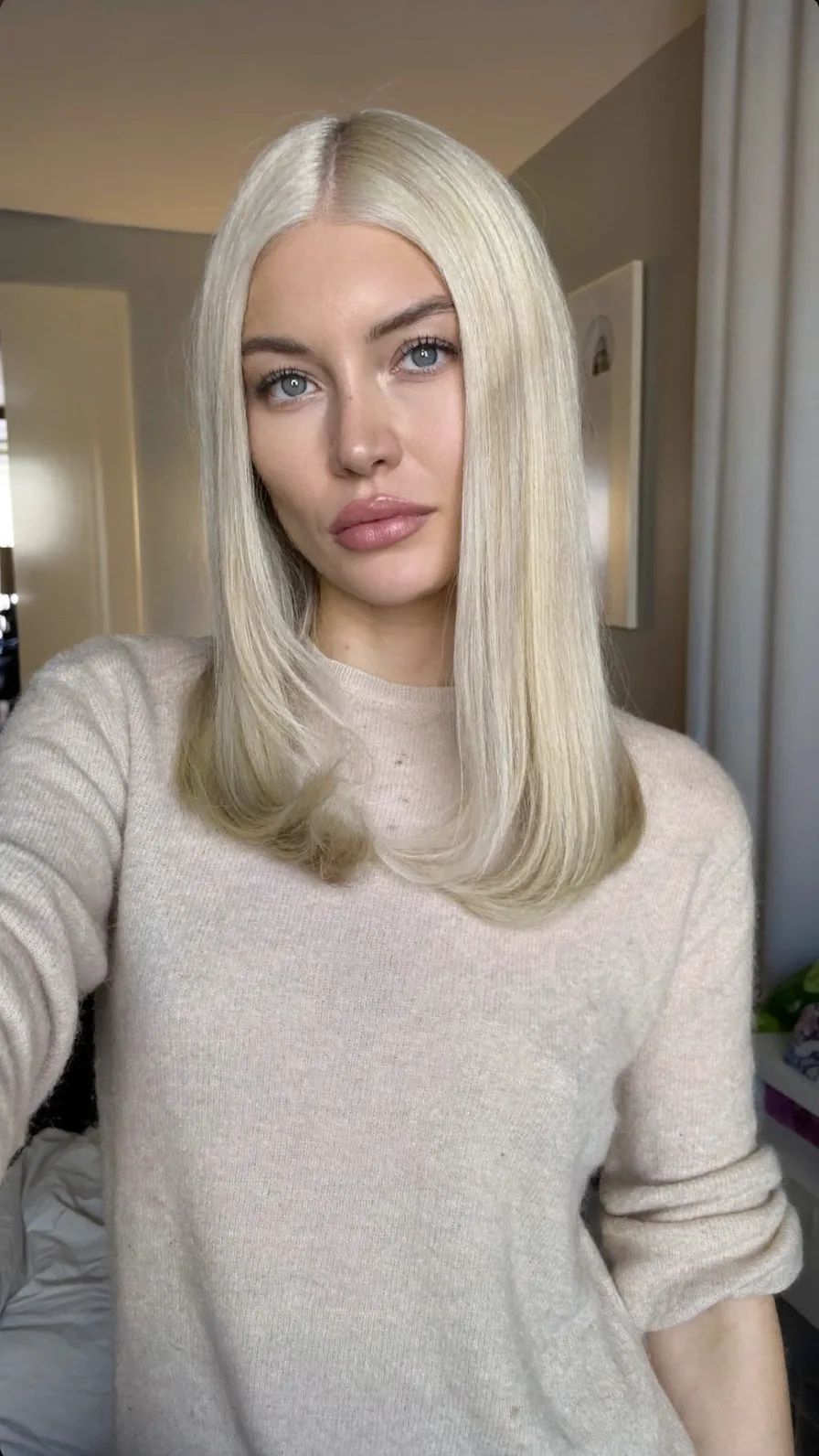 Sleek Shoulder-Length Platinum Blonde Blunt Lob Hairstyle