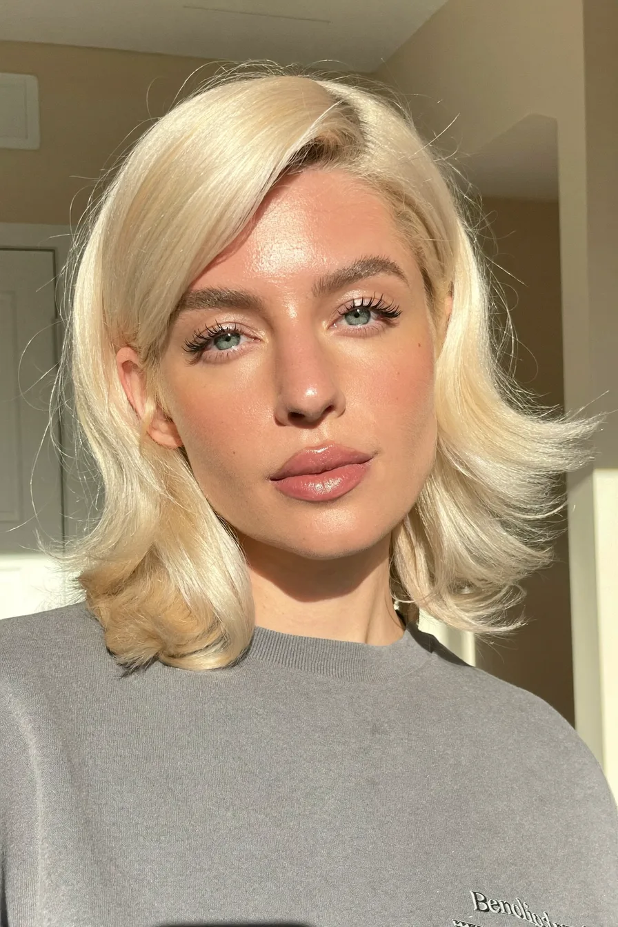 Sleek Shoulder-Length Platinum Blonde Bob with Side-Swept Bangs
