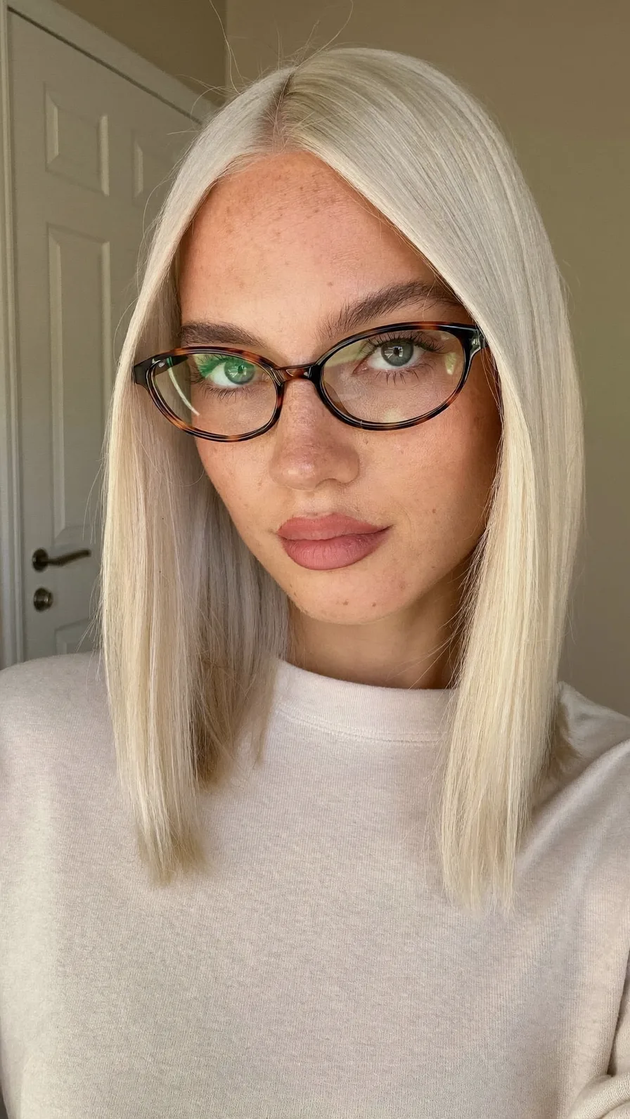 Sleek Platinum Blonde Blunt Lob with Center Part