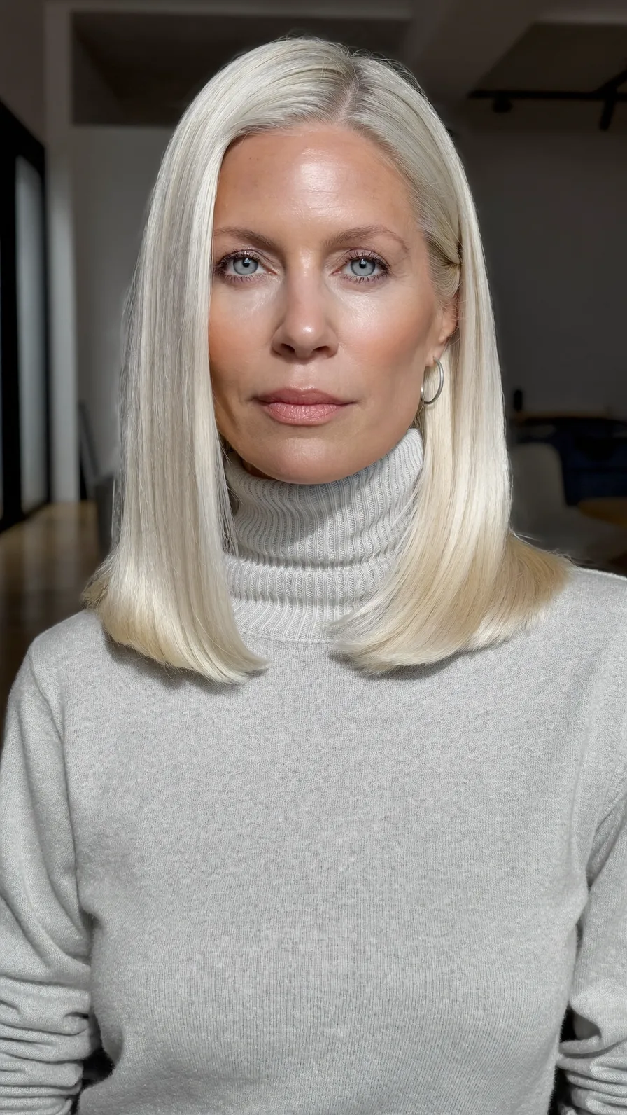 Sleek Platinum Blonde Blunt Bob with Center Part