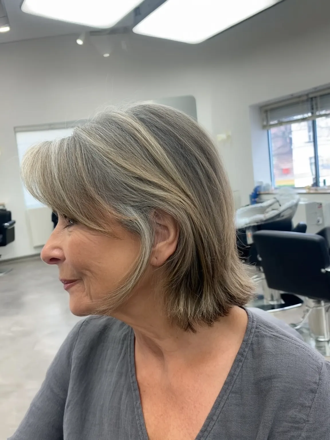 Silver Frost Bob with Side-Swept Bangs and Medium Volume