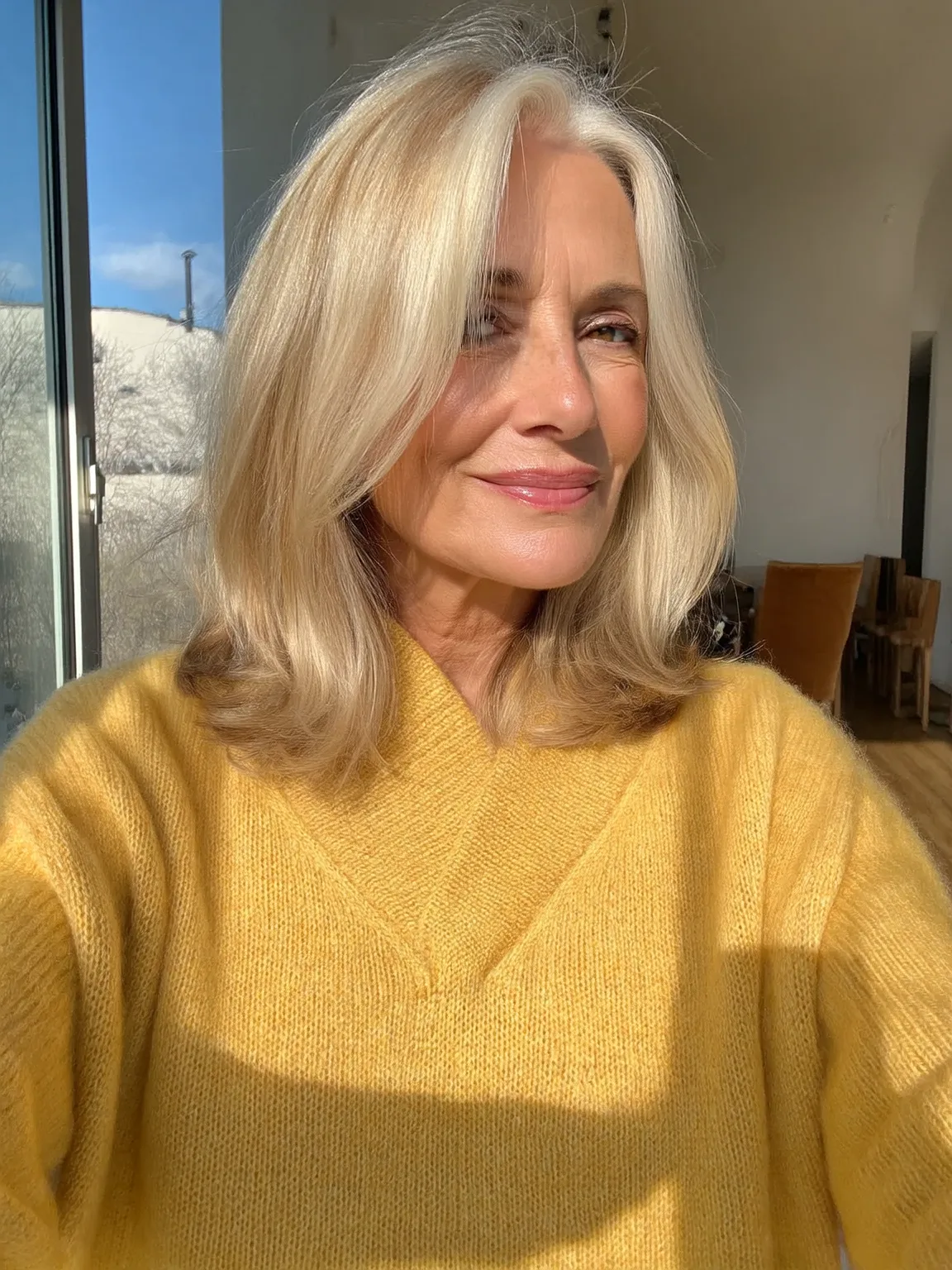 Sandy Blonde Straight Layers with Side-Swept Bangs