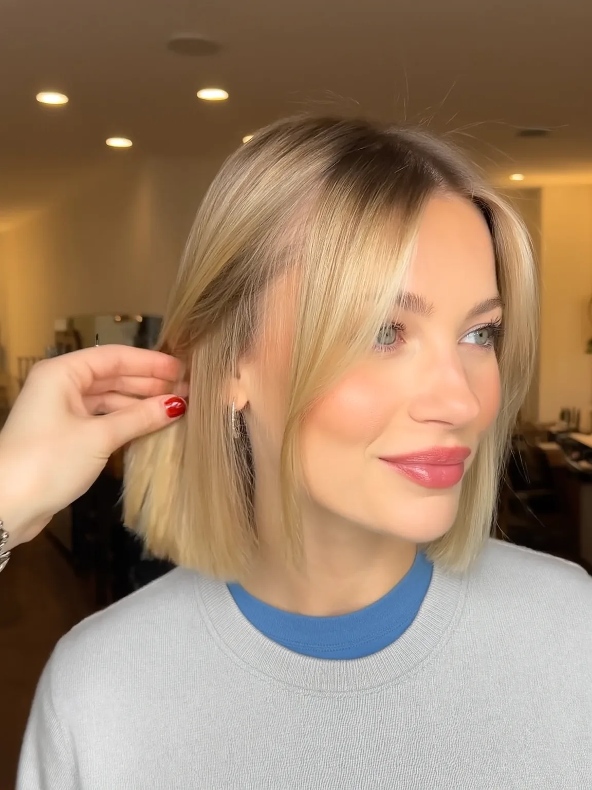 Sandy Blonde Bob with Curtain Bangs and Medium Volume