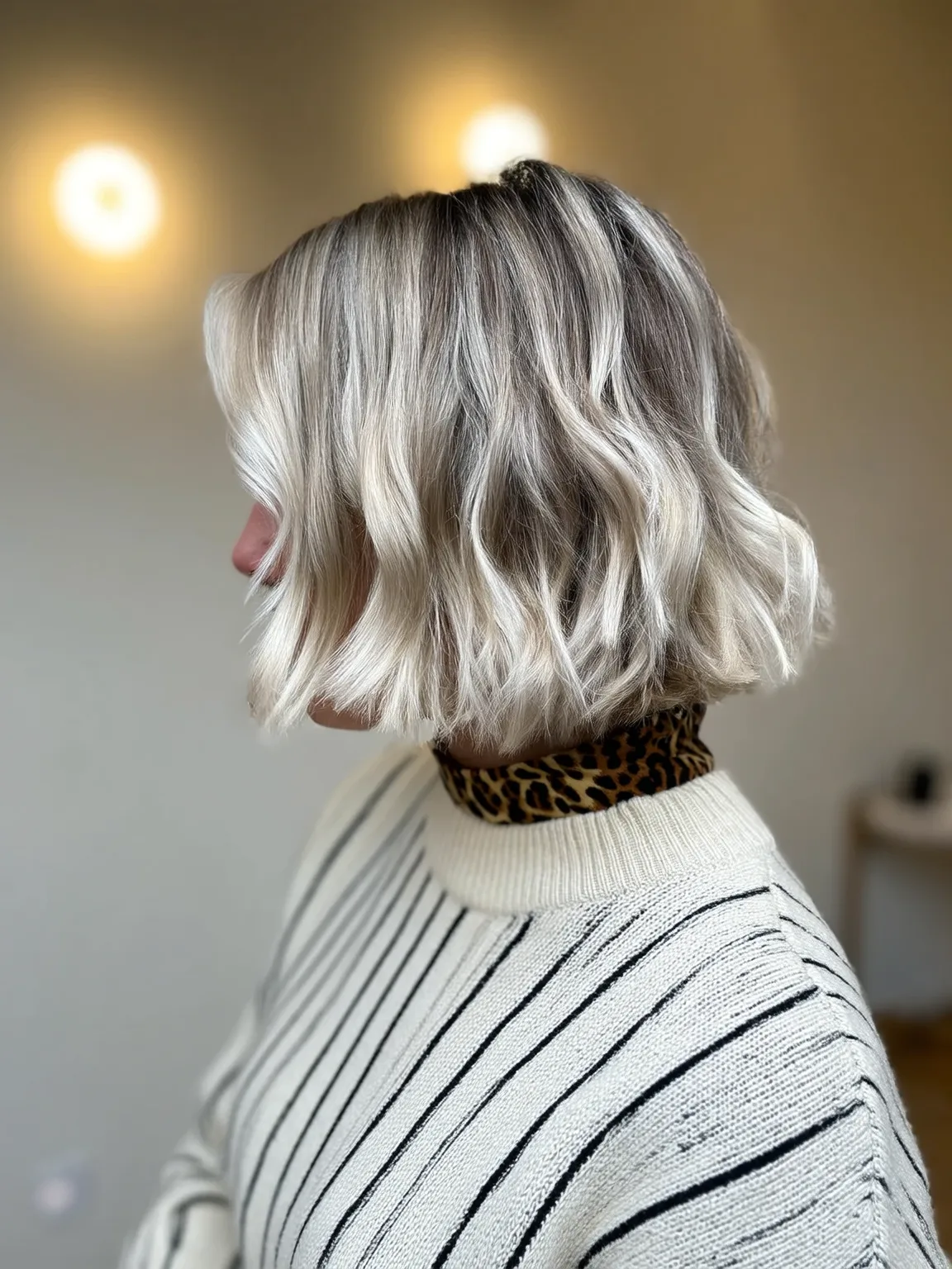 Voluminous Wavy Platinum Blonde Bob with Natural Roots