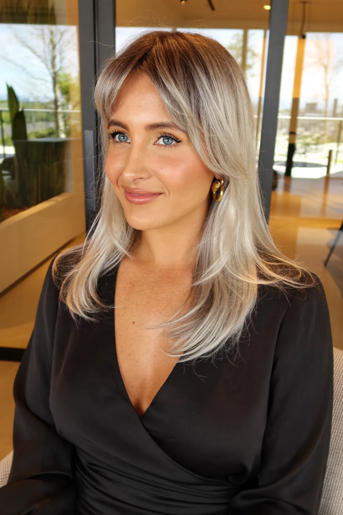 Modern Silver Balayage with Soft Curtain Bangs and Subtle Layers