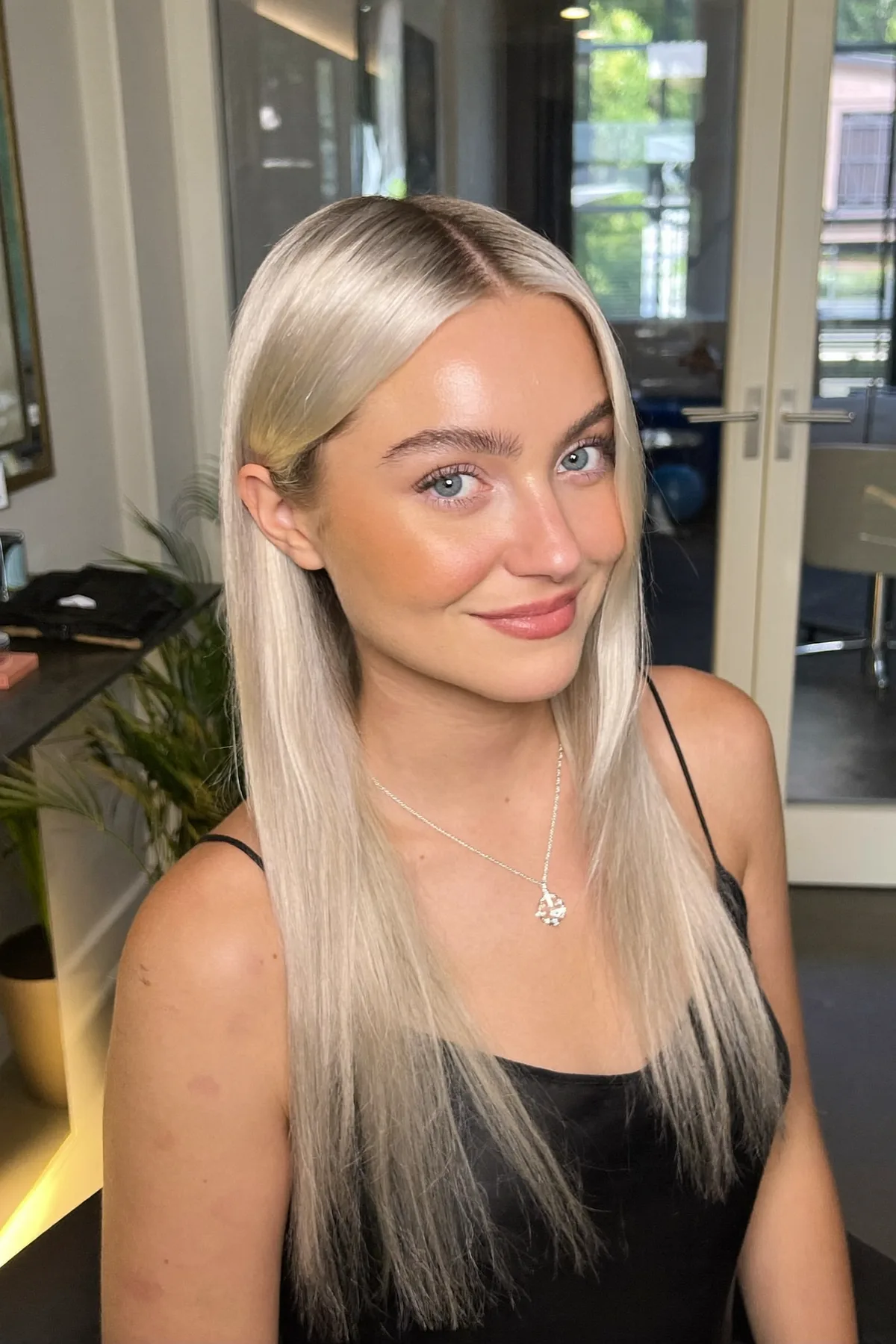 Radiant Silver Balayage on Sleek, Polished Long Layers