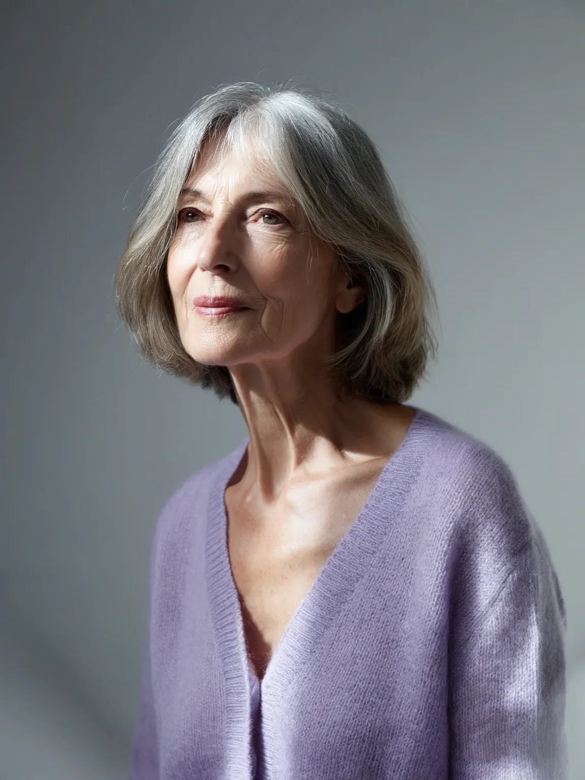 Natural Silver Bob with Grey Lowlights and Curtain Bangs