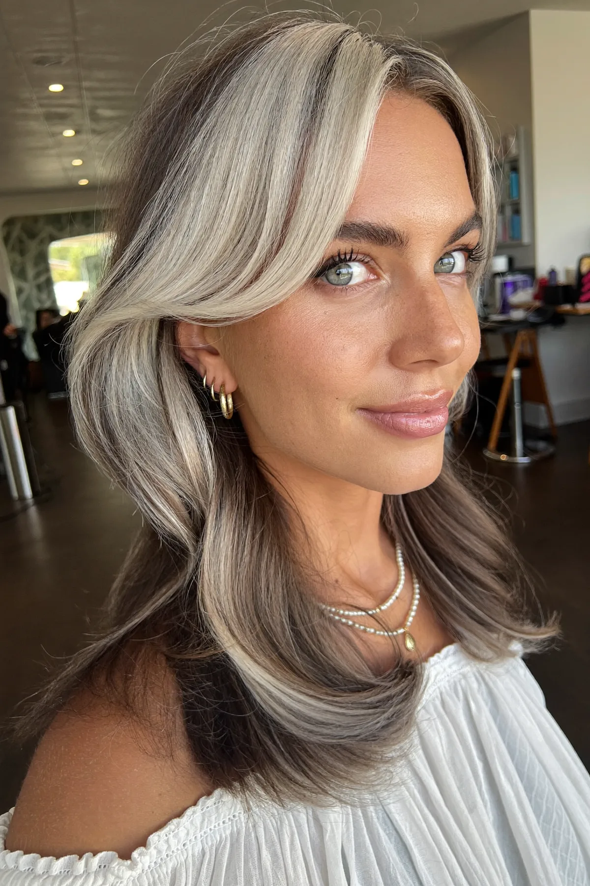 Modern Silver Fox Waves with Voluminous Curtain Bangs for Effortless Glamour
