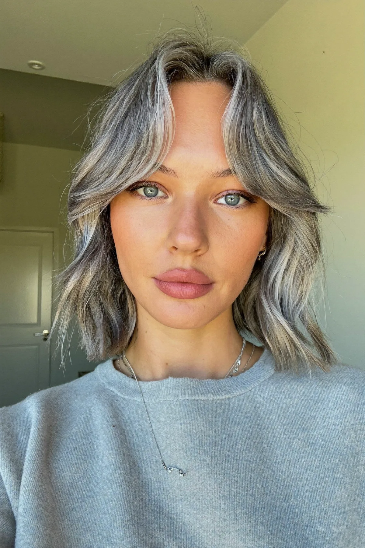 Sophisticated Silver Fox Bob with Effortless Curtain Bangs for Modern Elegance