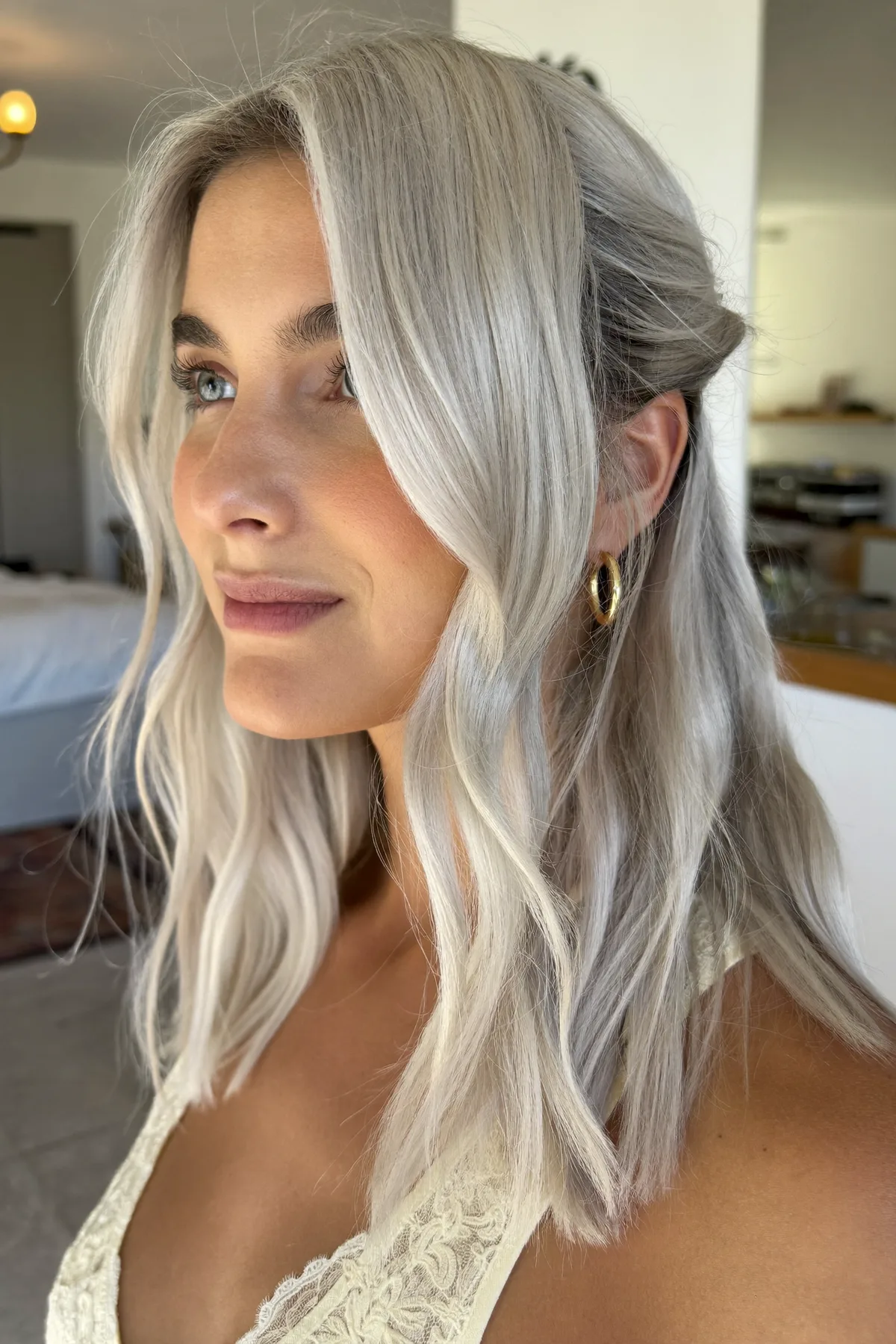 Silver Fox Glam: Effortless Long Layers with Soft Curtain Bangs