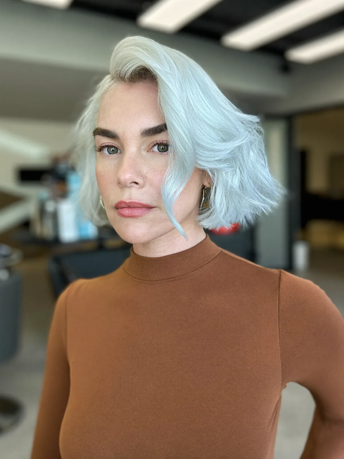 Silver Frost Side-Swept Wavy Bob with Voluminous Texture