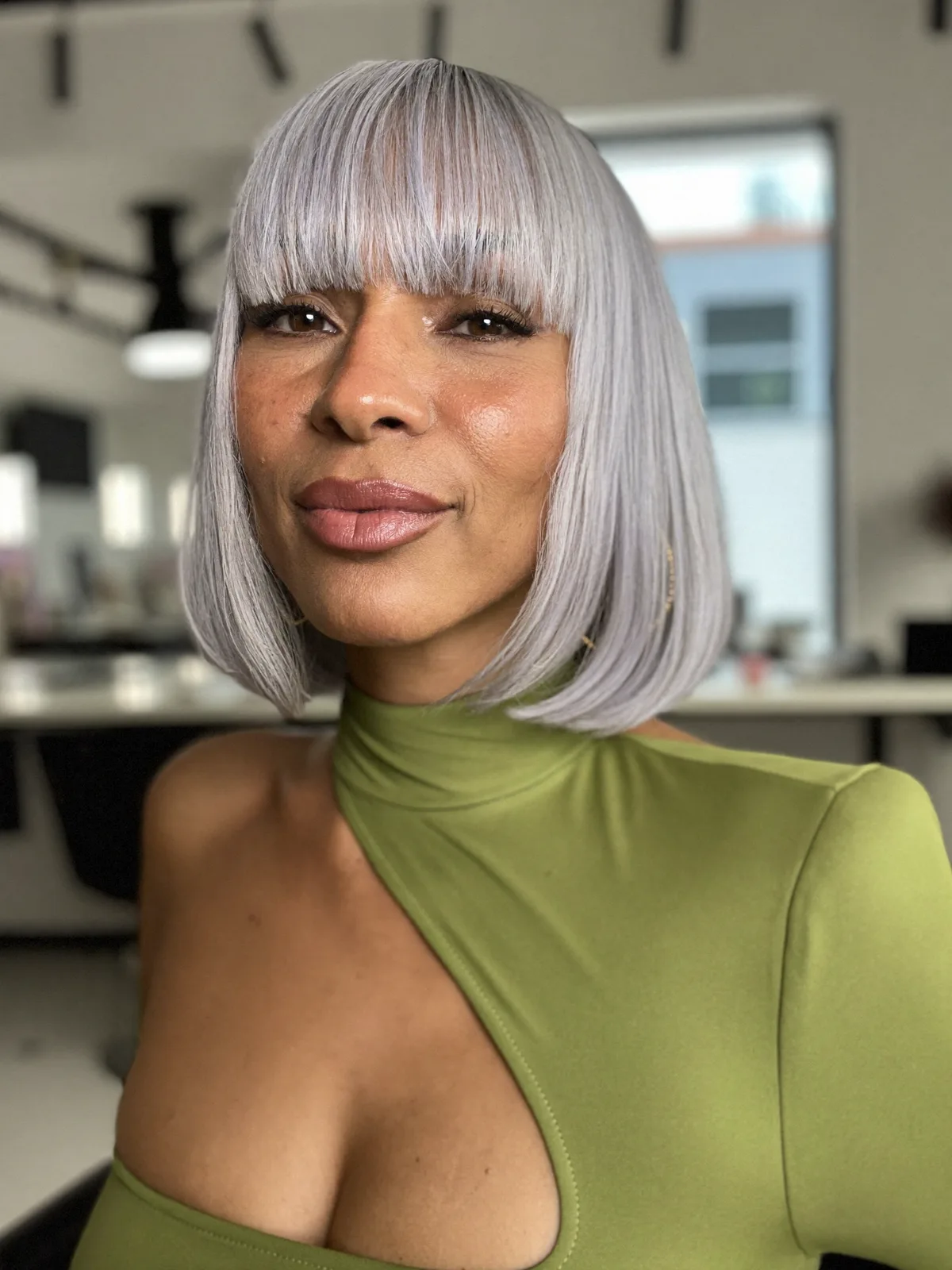 Sleek Silver Frost Bob with Full Blunt Bangs and Precision Cut