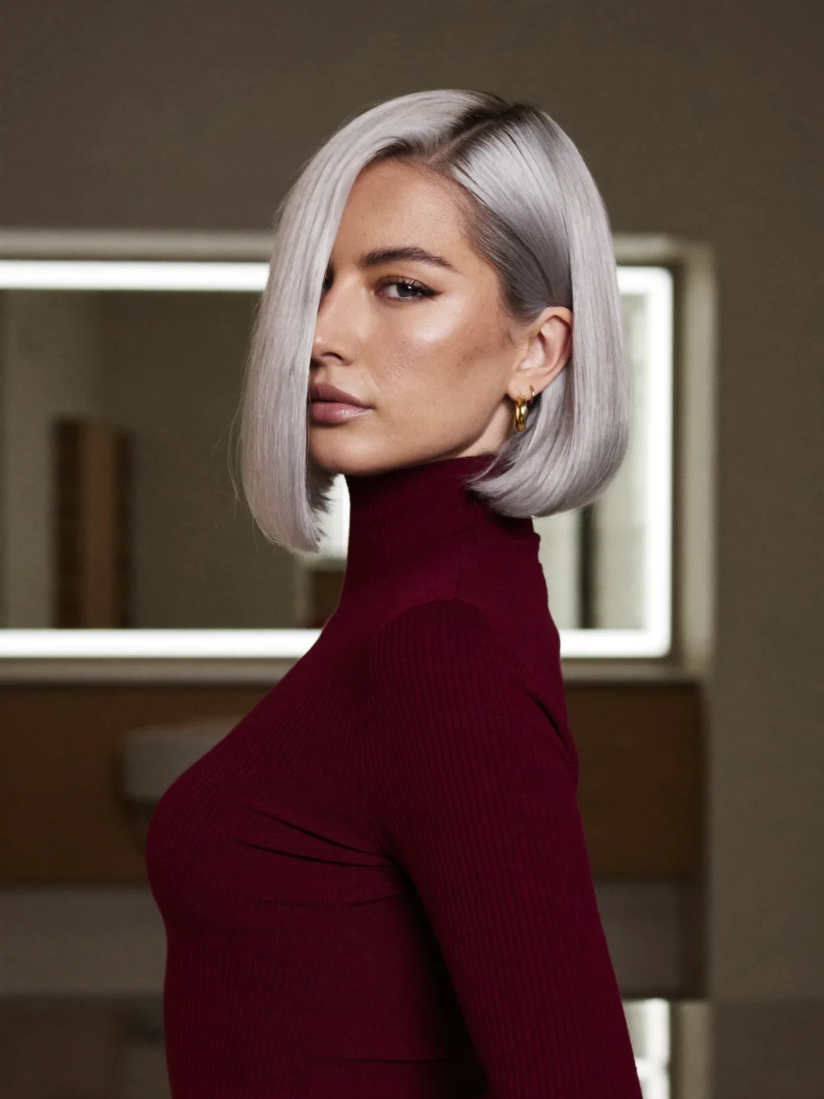 Smooth Silver Frost Angled Bob with Deep Side Part Definition