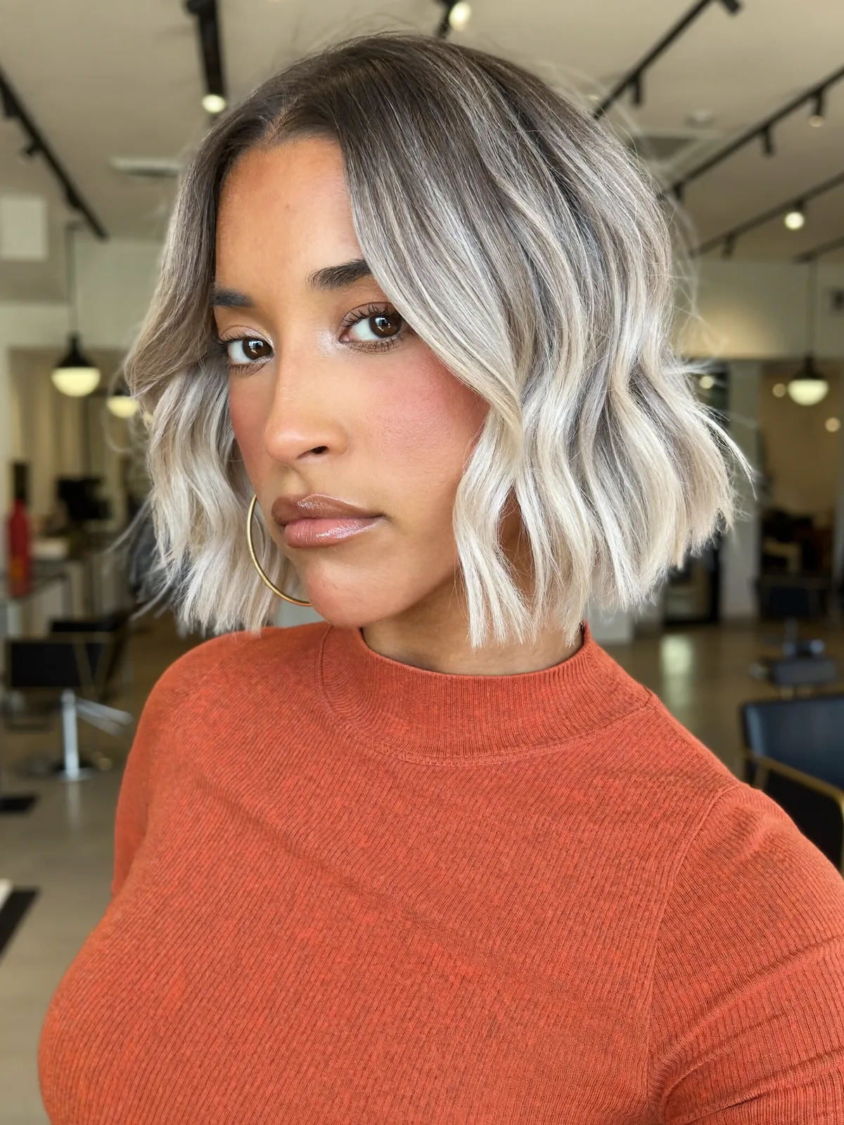 Silver Frost Wavy Bob with Dark Root Shadow and Textured Ends