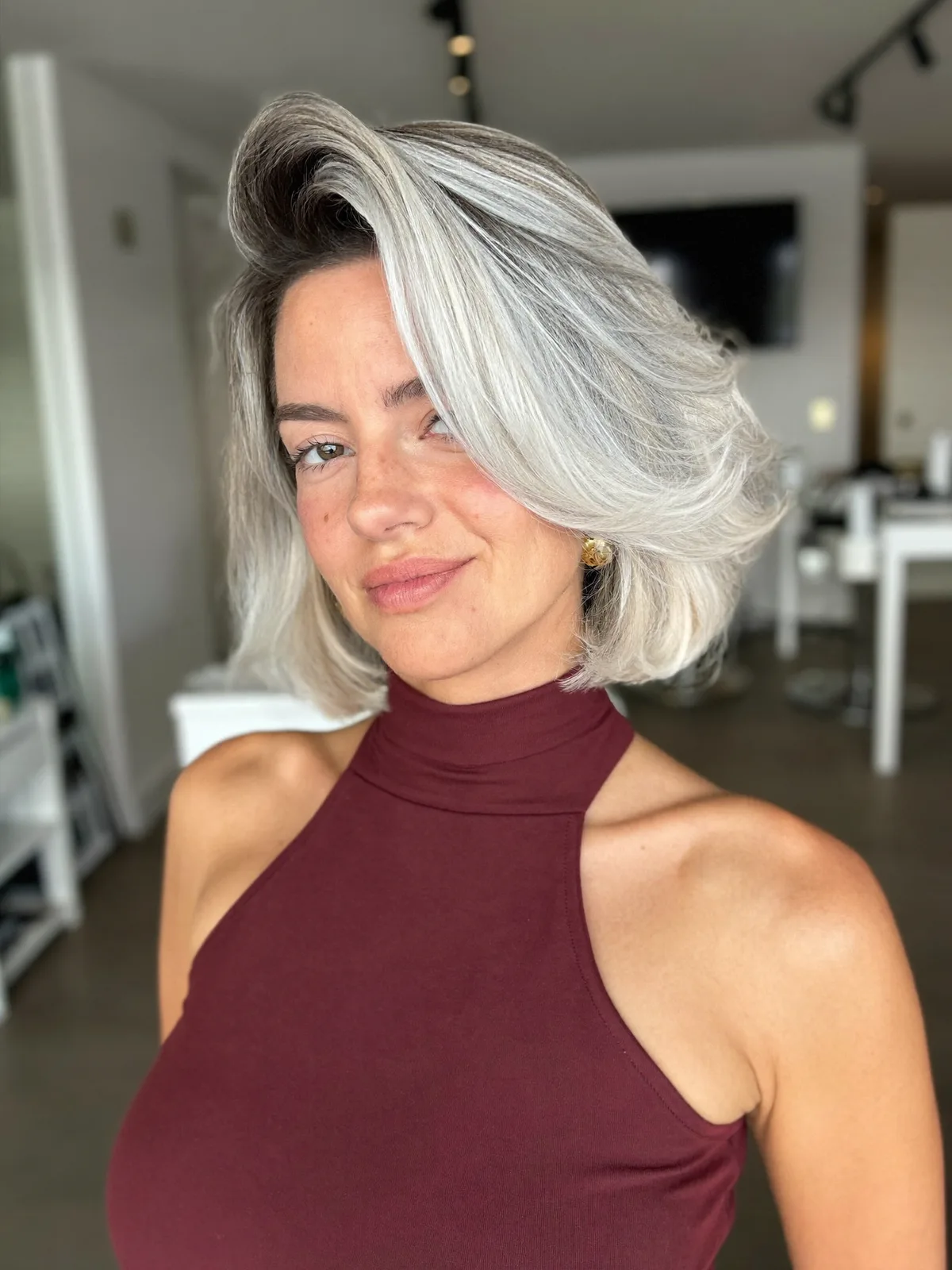 Silver Frost Voluminous Bob with Deep Side Part and Layers