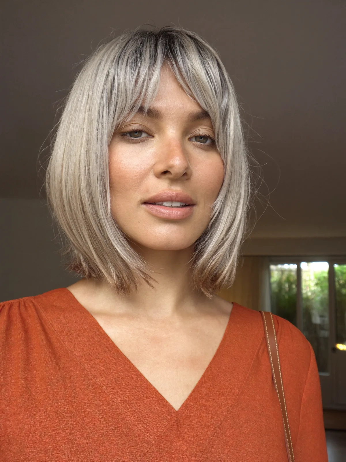 Silver Frost Bob with Soft Curtain Bangs for Modern Elegance