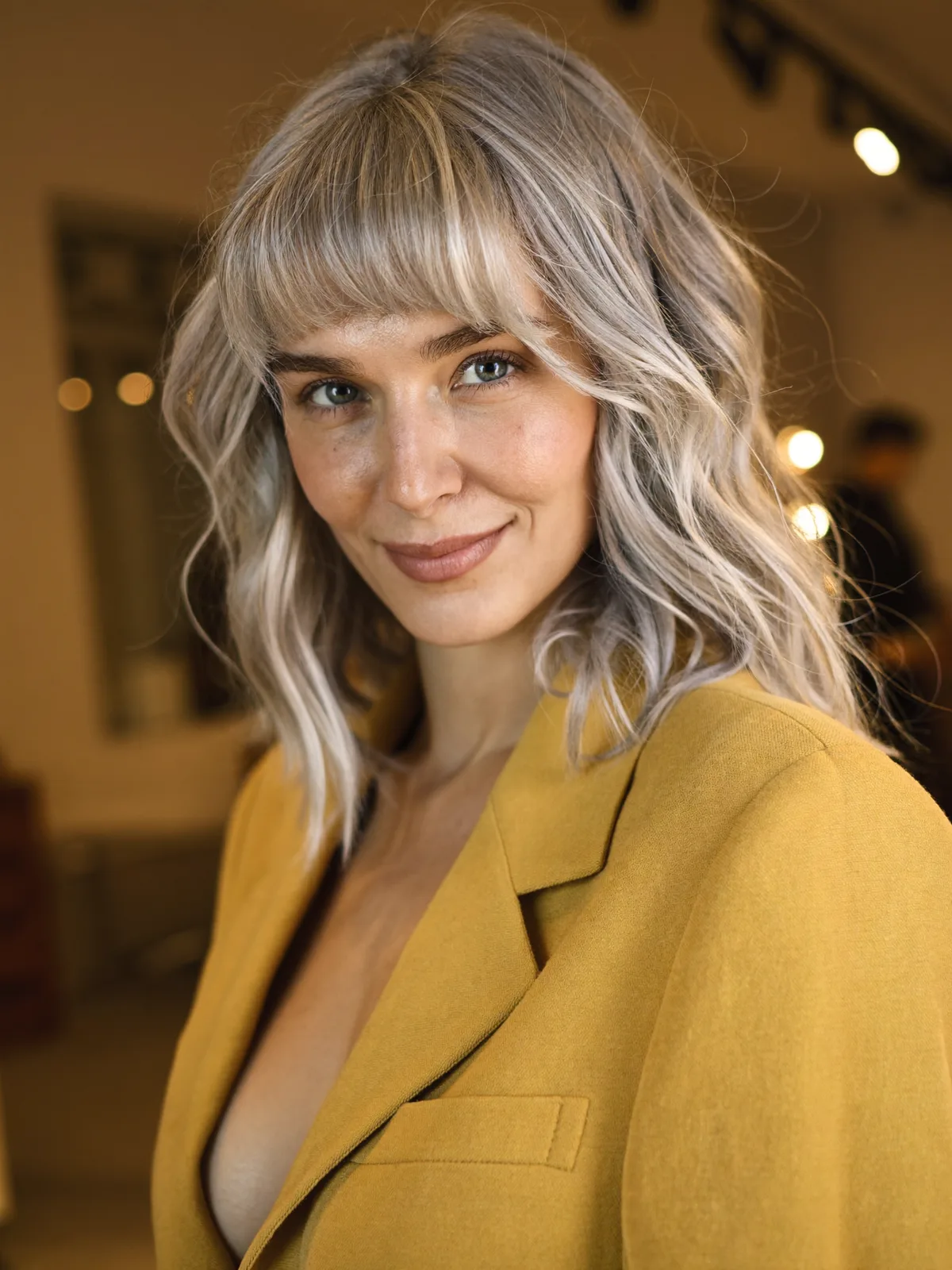 Soft Silver Frost Lob with Tousled Natural Waves and Bangs