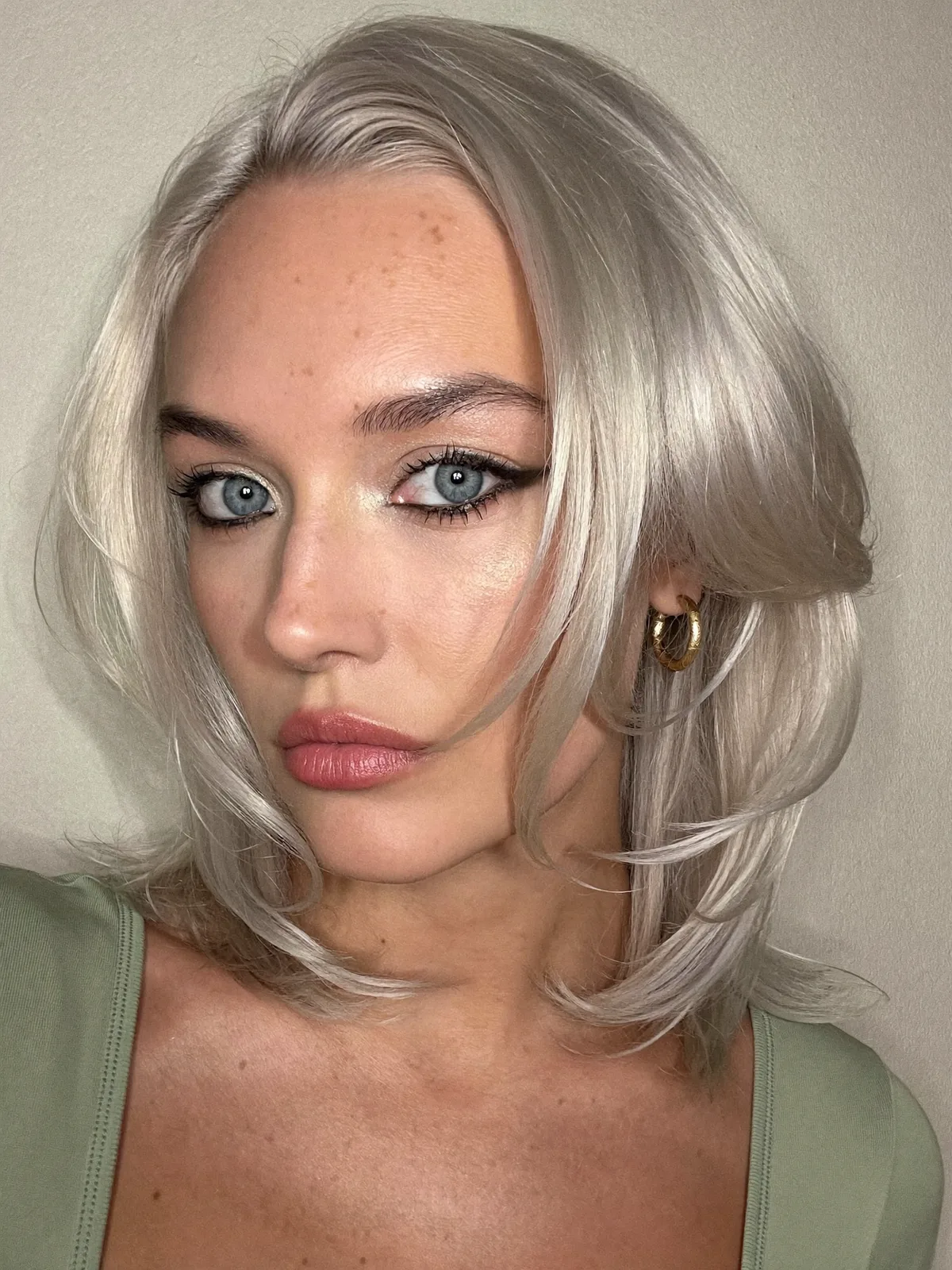Silver Frost Long Layered Bob with Face-Framing Flicks