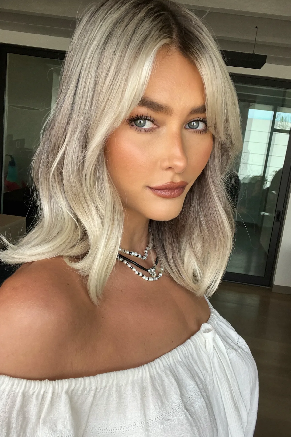 Silver Frost Balayage Lob with Curtain Bangs and Natural Texture