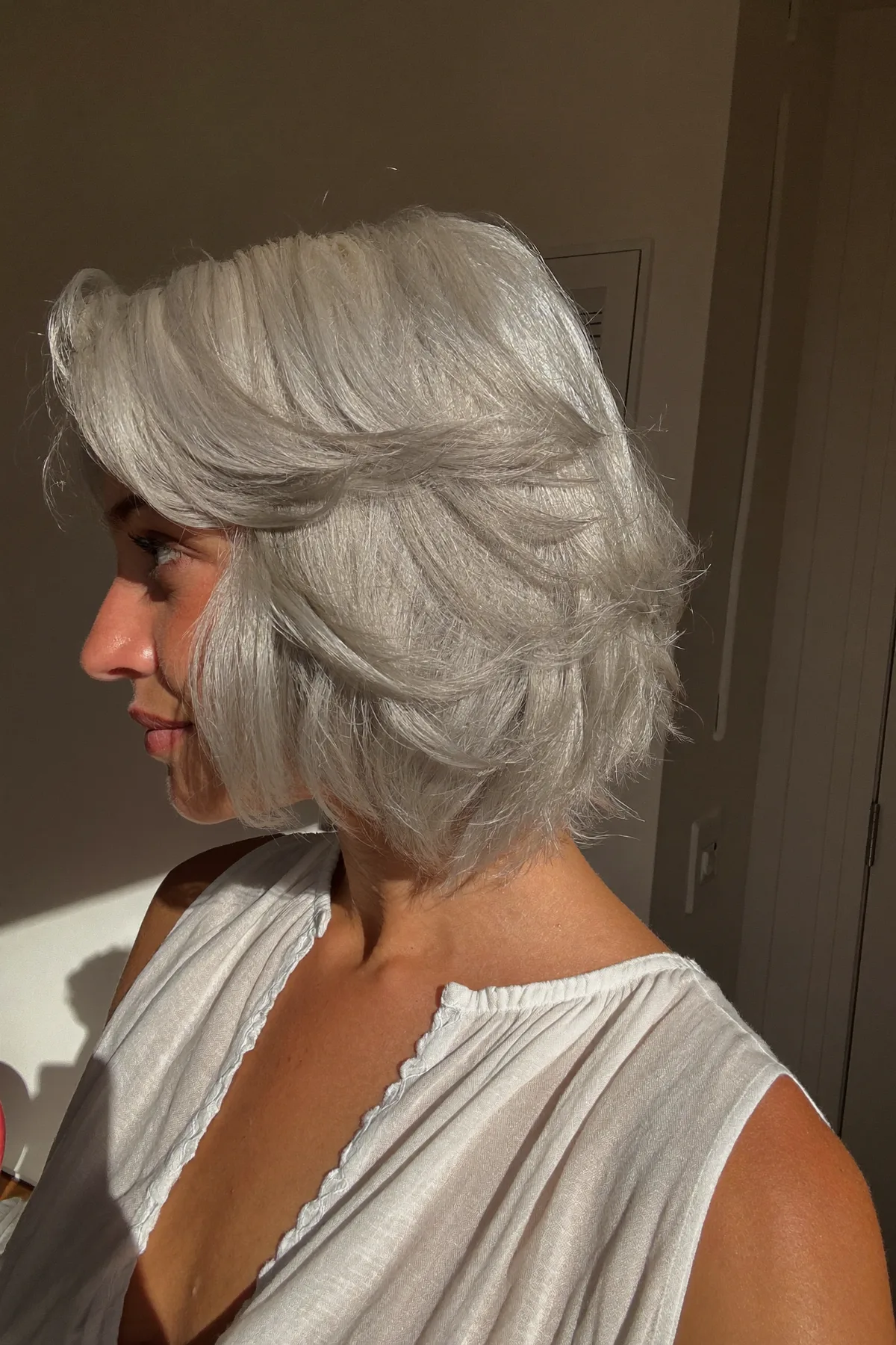 Silver Frost Layered Bob with Voluminous Feathered Ends