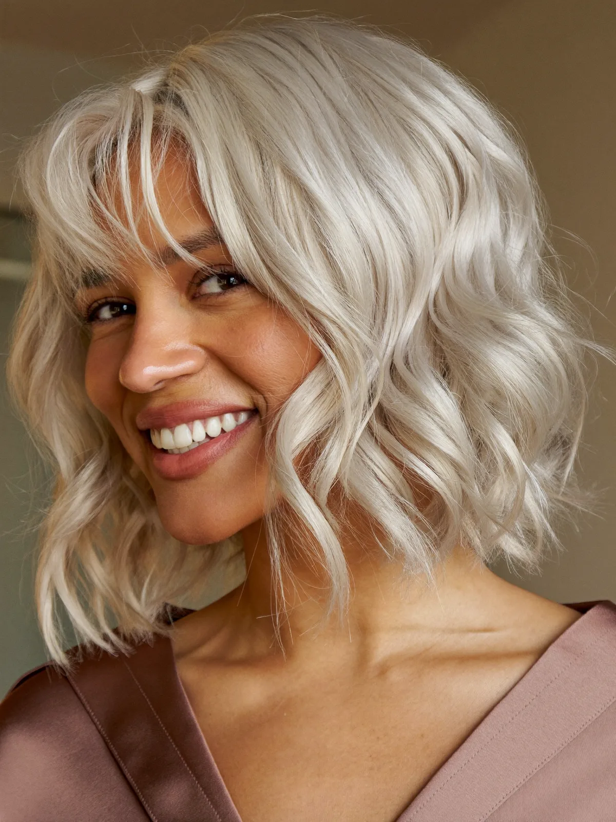 Chic Silver Frost Bob with Soft Natural Waves and Bangs