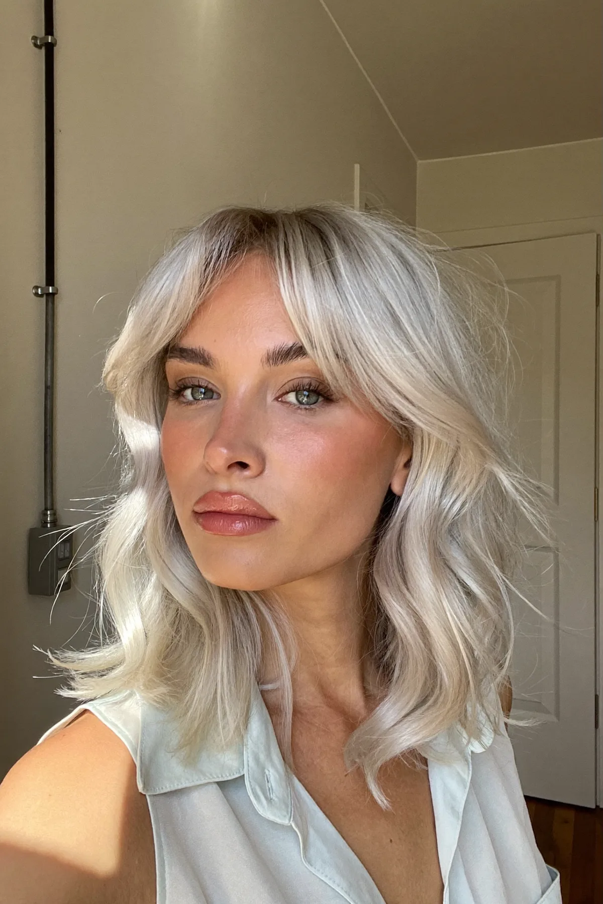 Silver Frost Lob with Soft Natural Waves and Curtain Bangs