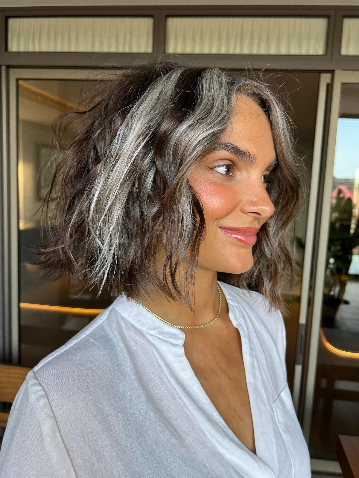 Silver Frost Highlights on Textured Jaw-Length Bob Hairstyle