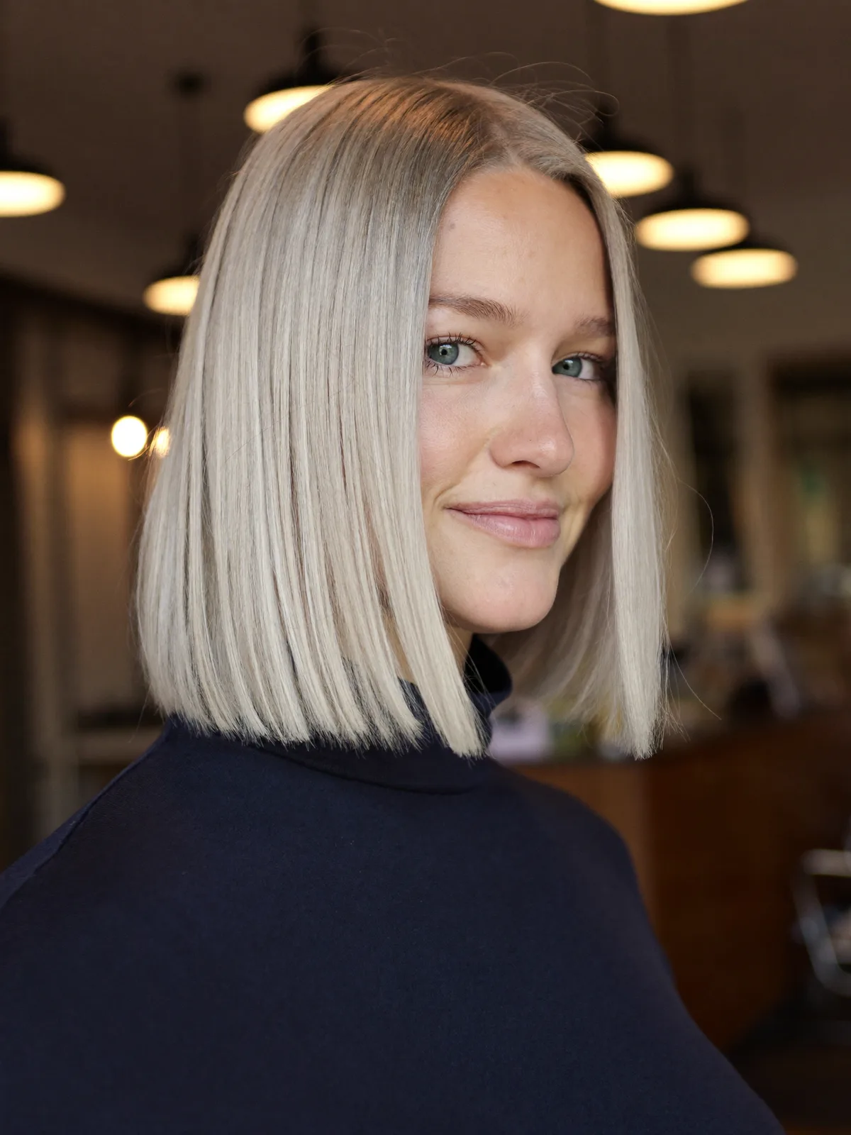 Sleek Silver Frost Blunt Bob With Center Part Styling
