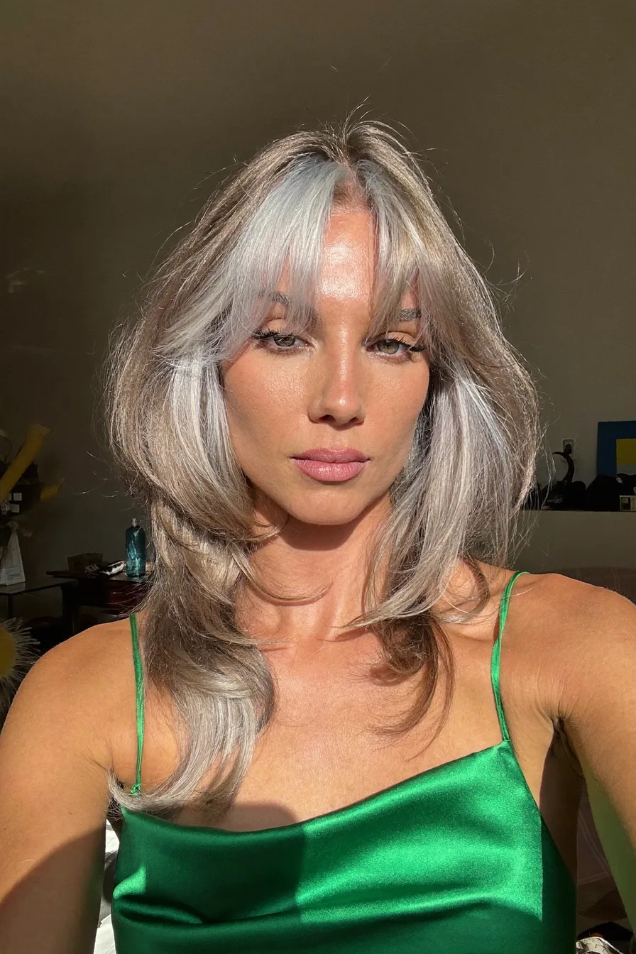 Layered Blowout With Wispy Bangs in Silver Gray Tones