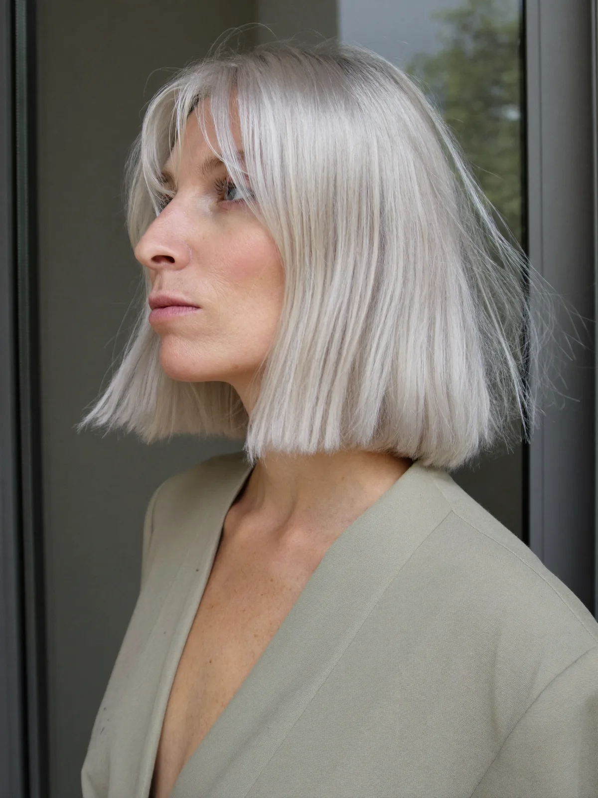 Platinum Silver Bob with Soft Curtain Bangs for Face-Framing Elegance