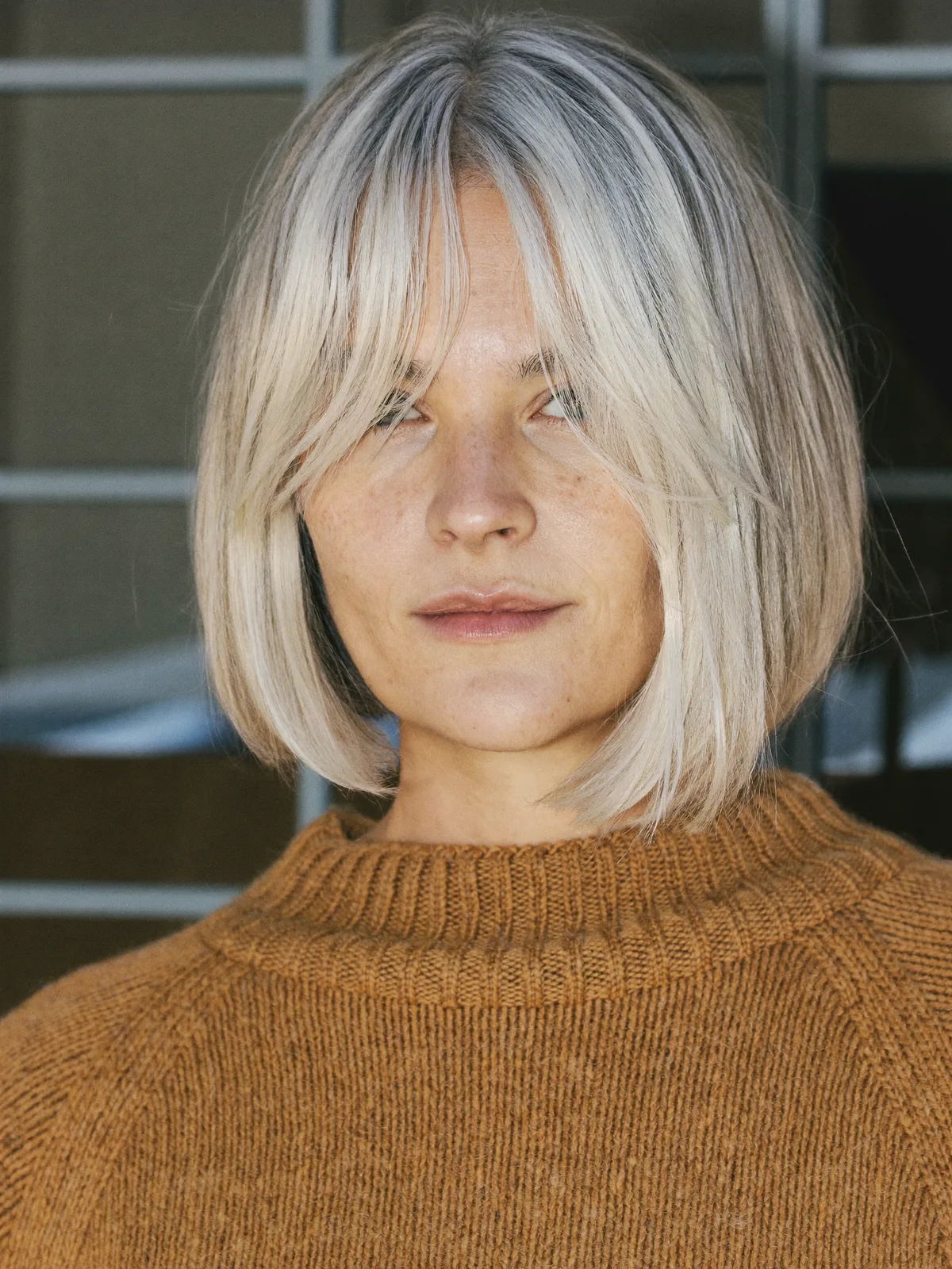 Chic Silver Bob with Soft Face-Framing Curtain Bangs