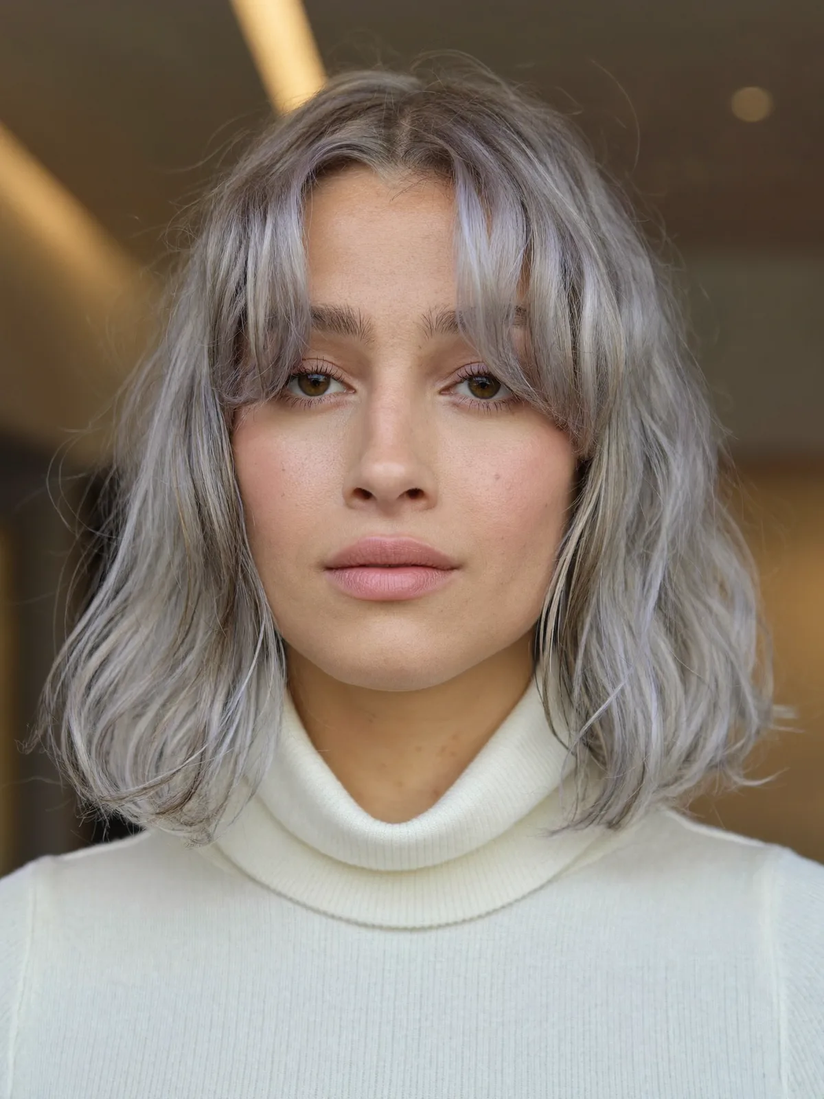 Soft Silver Bob with Face-Framing Curtain Bangs for Effortless Elegance