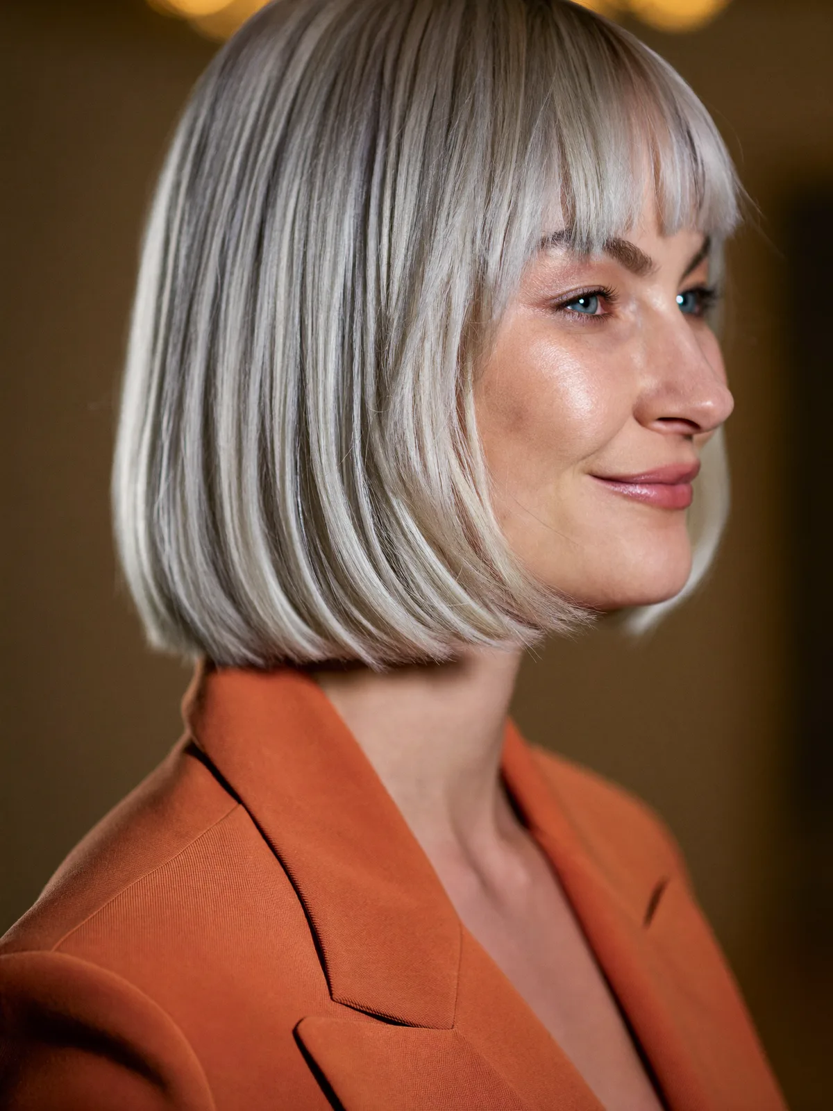 Sleek Silver Bob with Soft Curtain Bangs for Face Framing