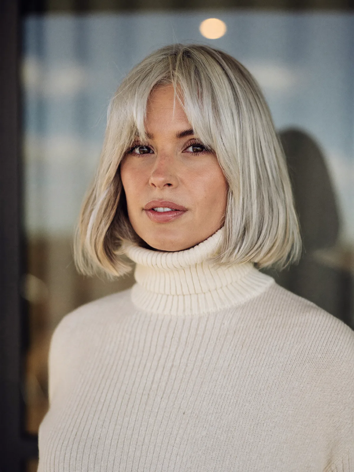Chic Silver Bob with Soft Curtain Bangs for Face-Framing Elegance
