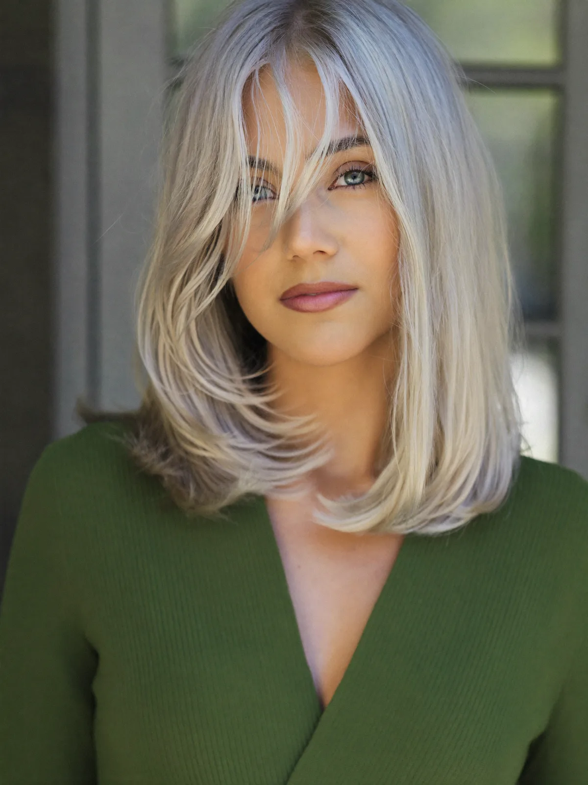 Platinum Silver Layers with Soft Curtain Bangs for Face Framing