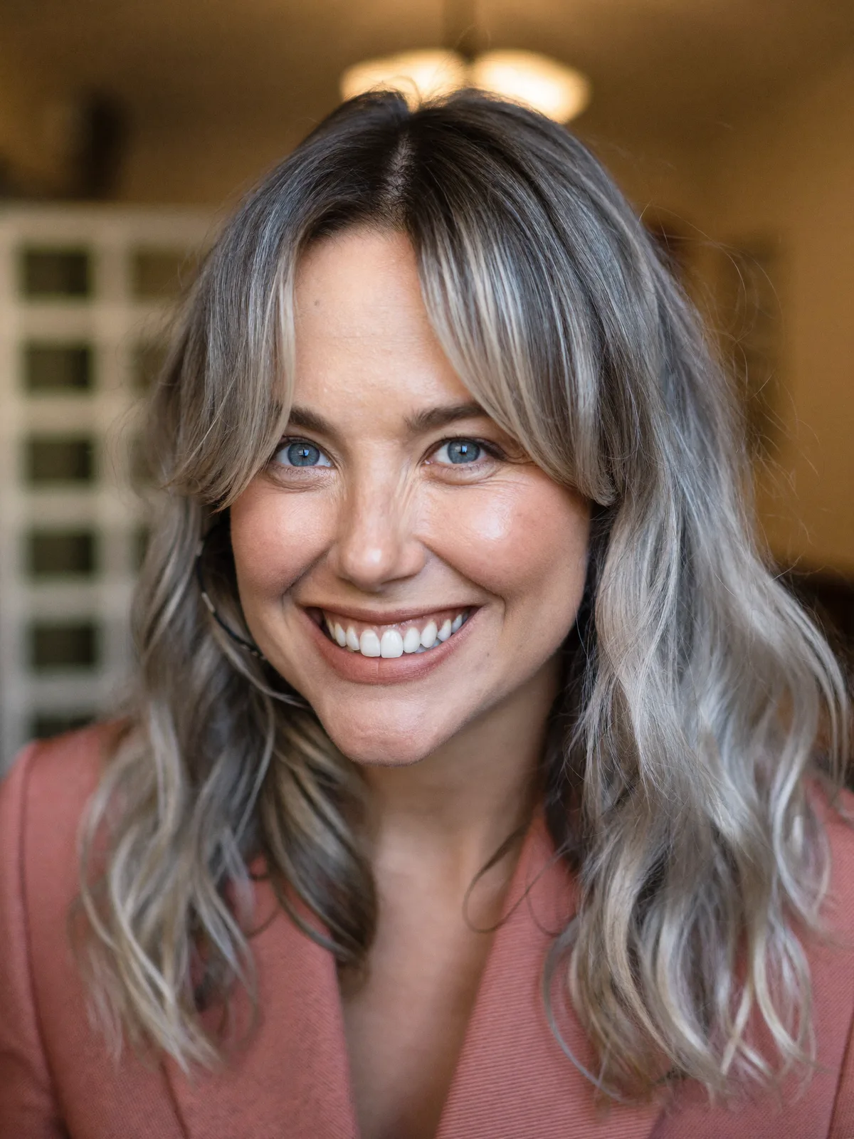 Soft Silver Balayage Waves with Face-Framing Curtain Bangs