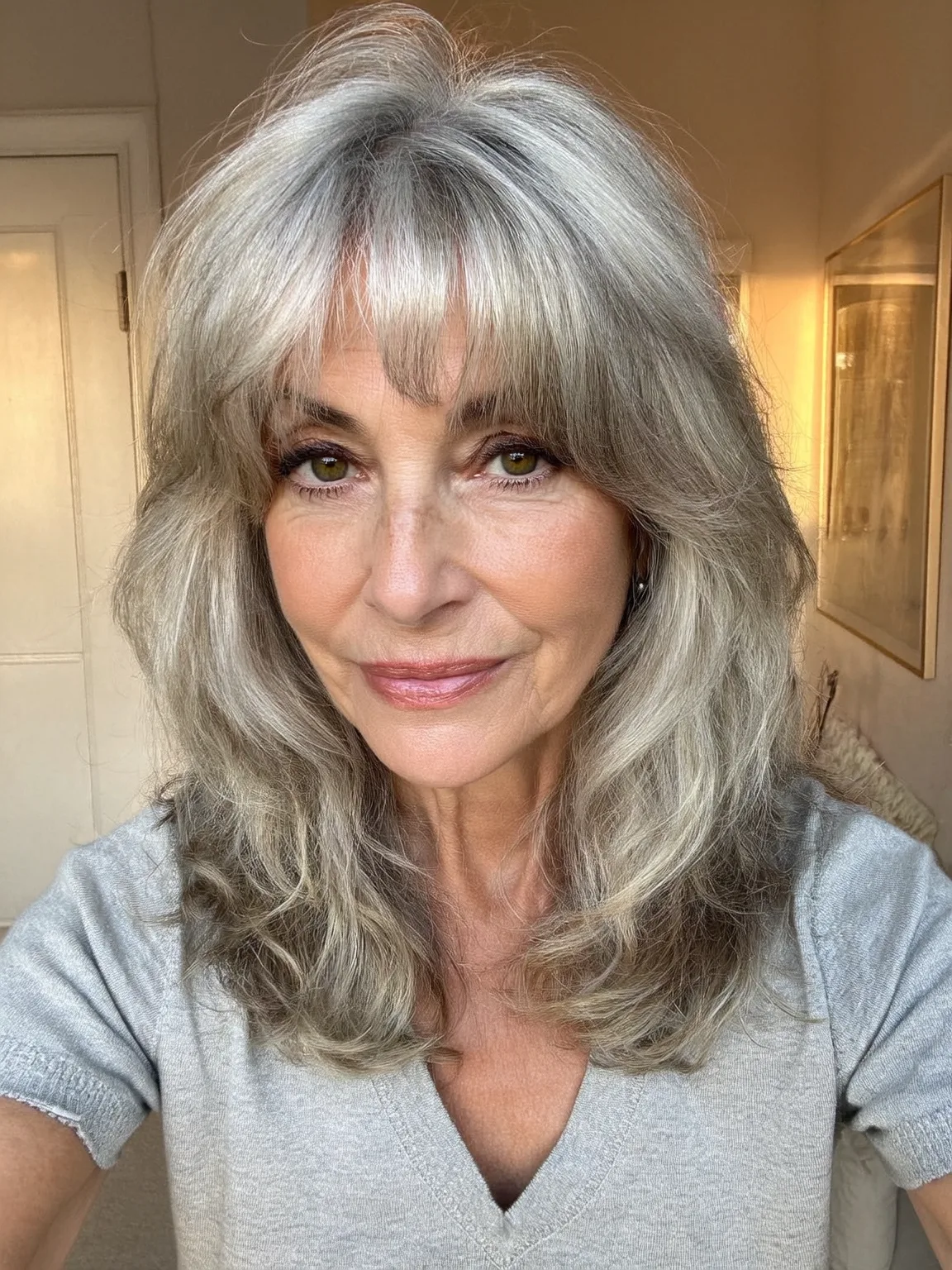 Shoulder-Length Silver Frost Layers with Curtain Bangs