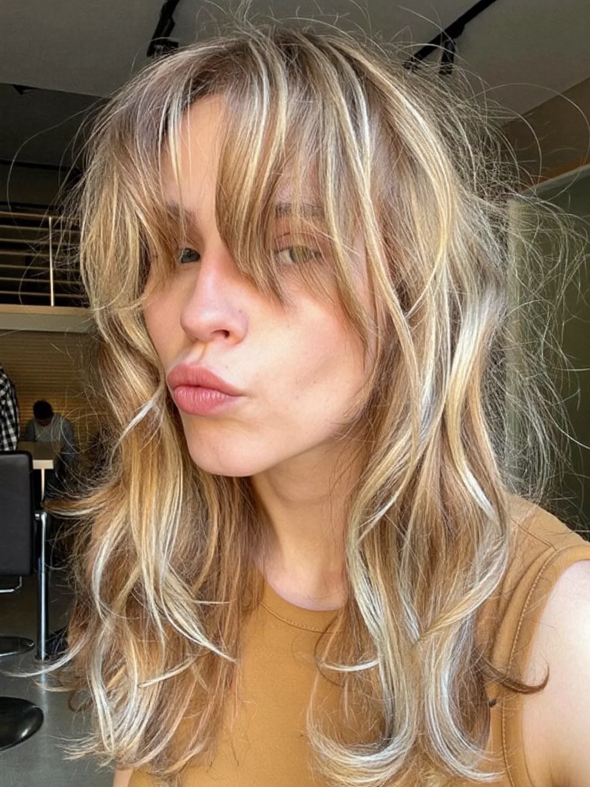Soft Wolf Cut With Long Textured Bangs and Natural Layers