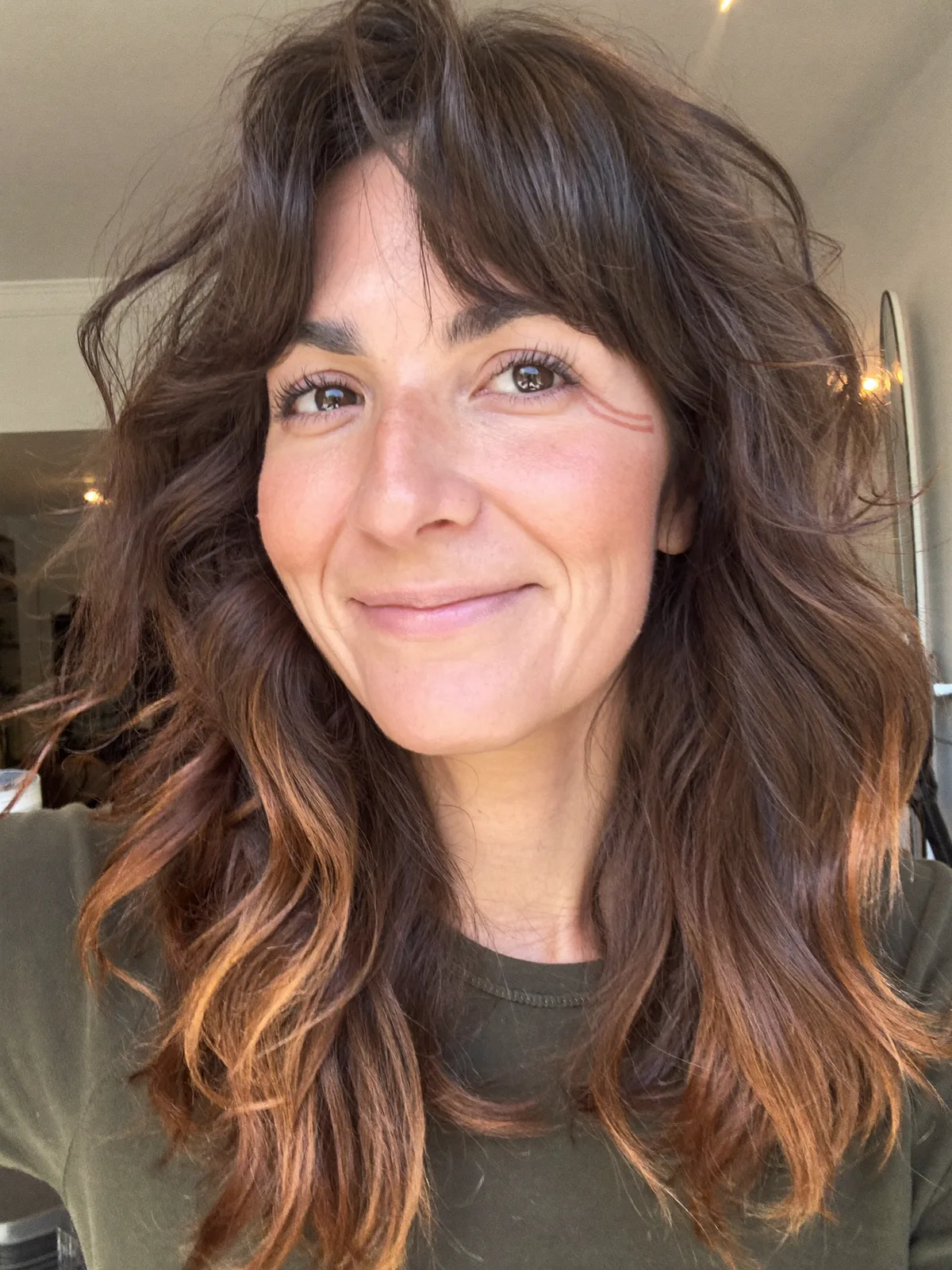 Soft Wolf Cut with Curtain Bangs and Tousled Layers for Effortless Volume