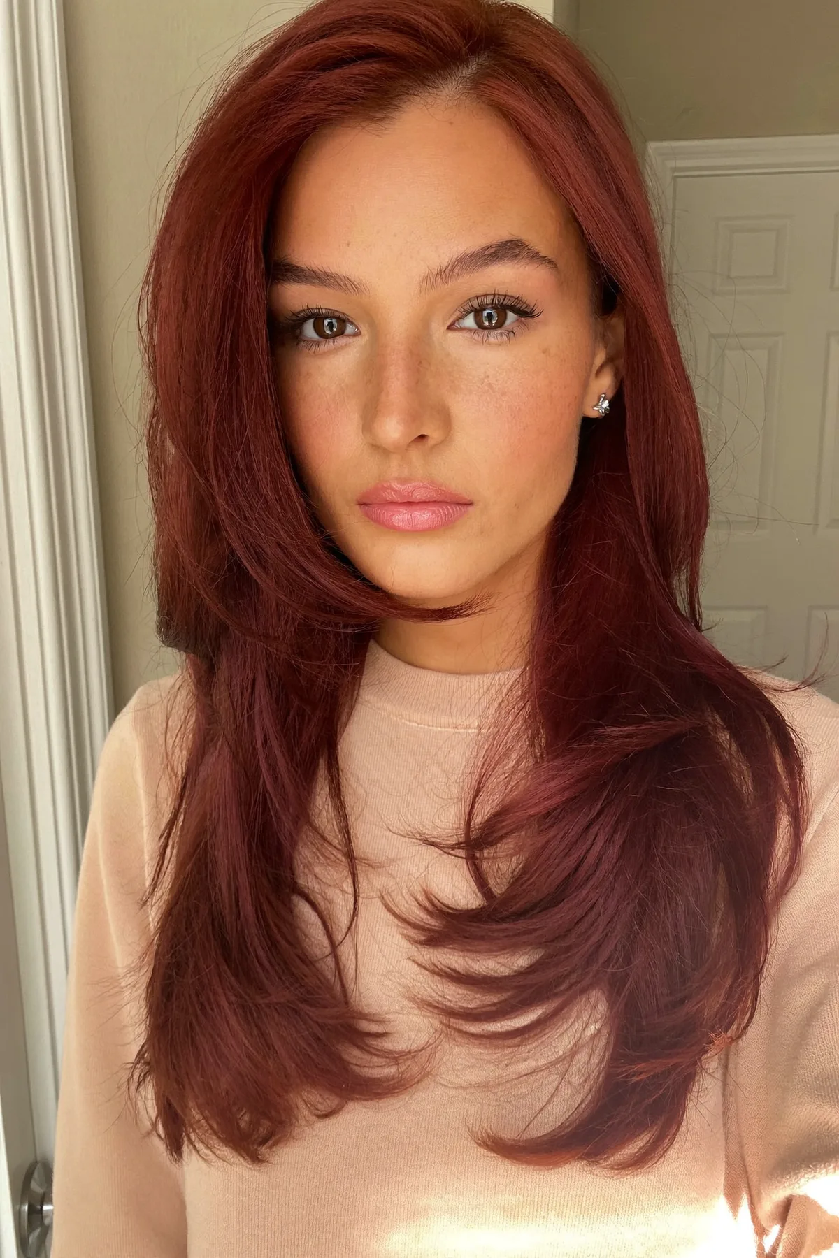 Sleek Auburn Copper Collarbone-Length Lob with Curtain Bangs