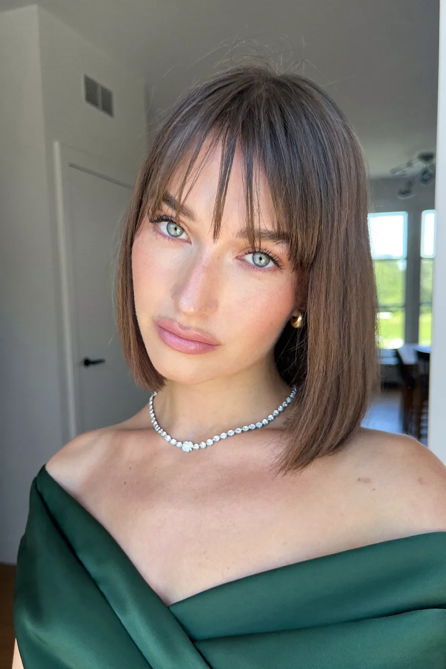 Chic Straight Bob with Light Wispy Bangs for a Modern Edge