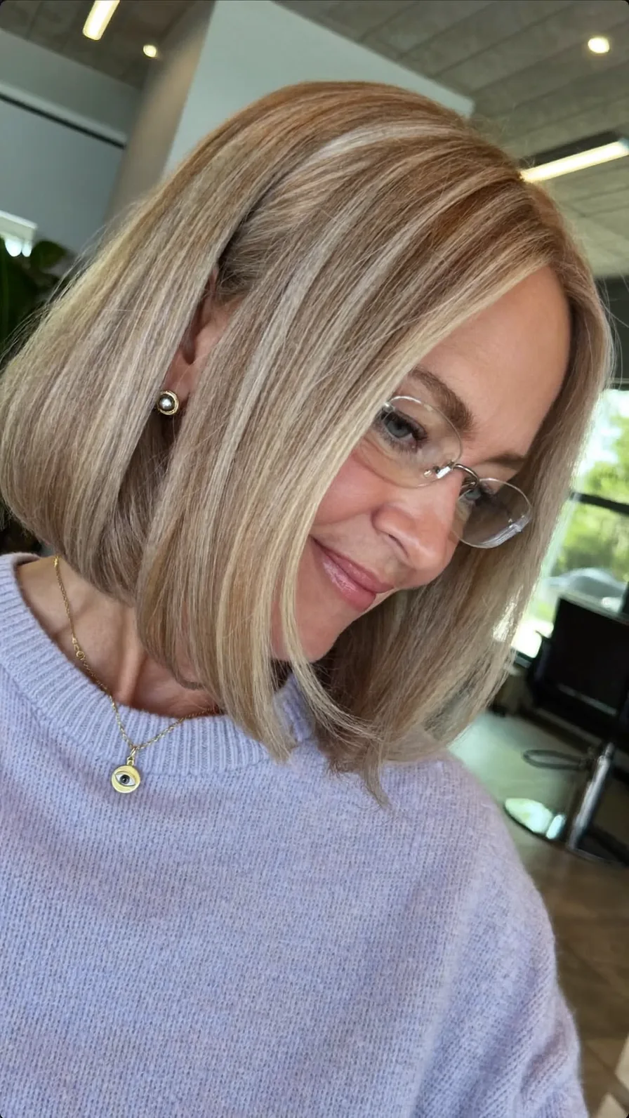 Sophisticated Chin-Length Blunt Bob with Warm Blonde Highlights