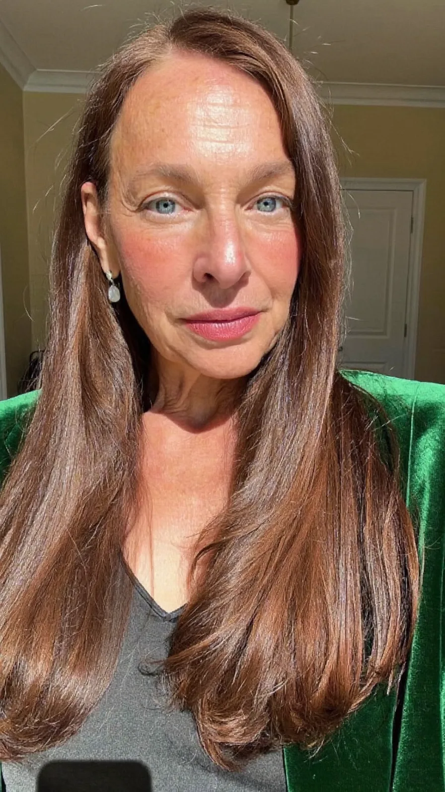 Sleek Long Layers with Side-Swept Bangs for Mature Women