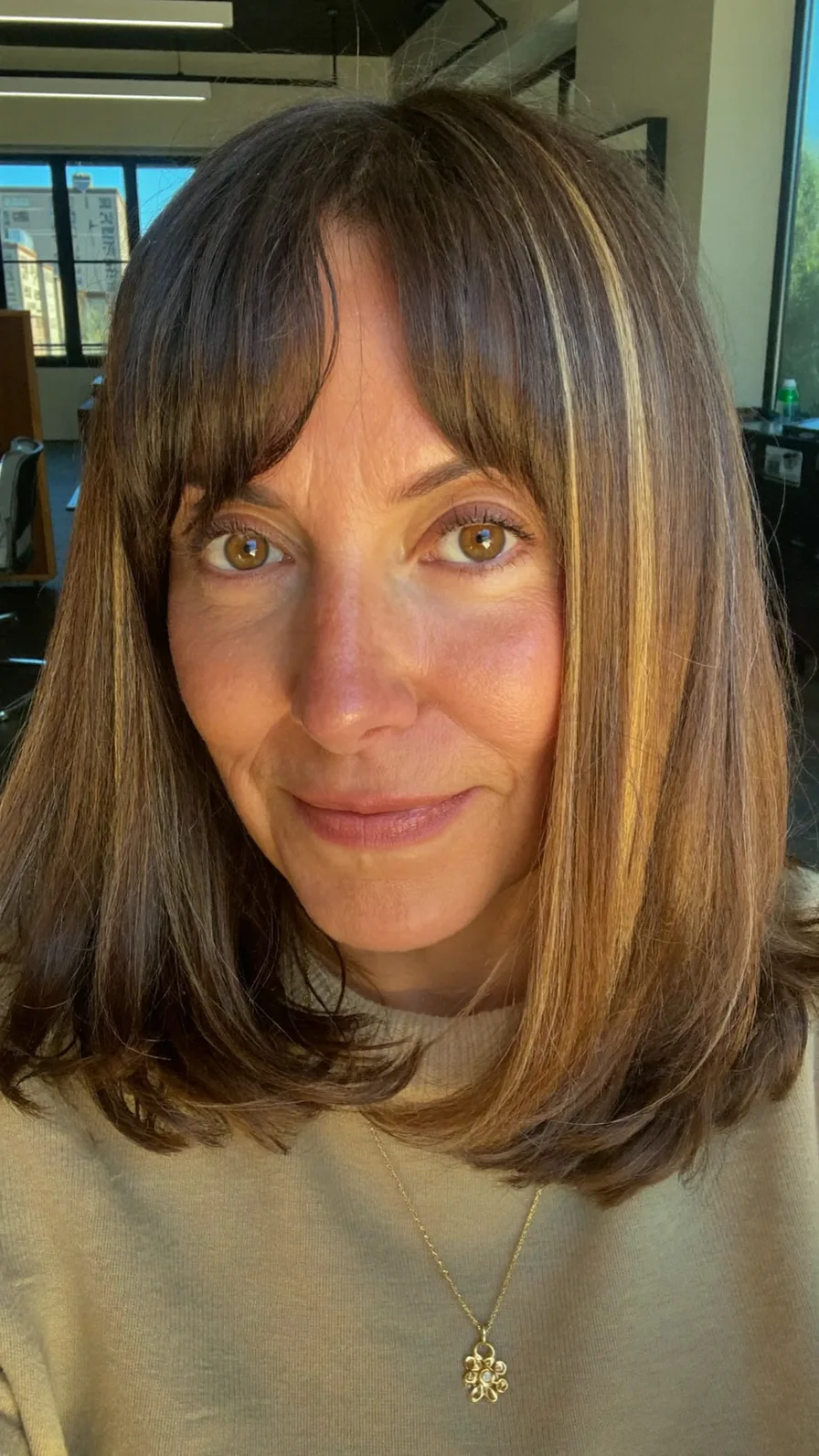 Shoulder-Length Long Layers with Curtain Bangs and Highlights