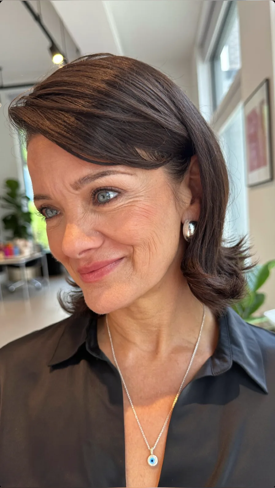 Sophisticated Shoulder-Length Dark Brown Hair with Side-Swept Layers
