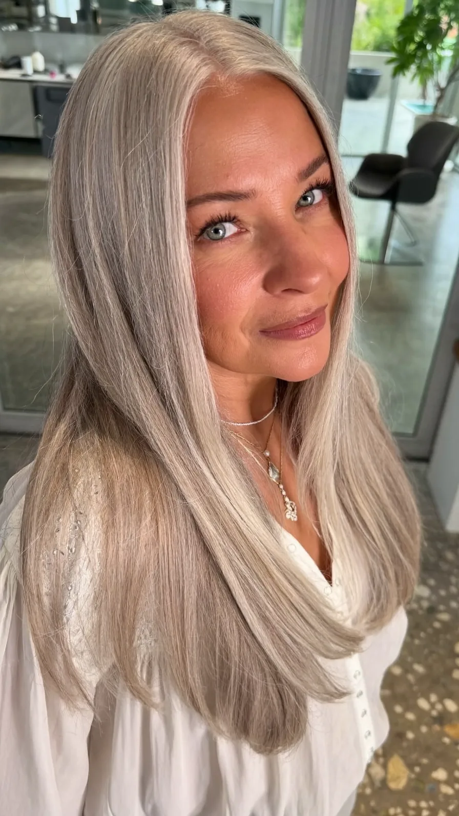 Elegant Medium-Length Layered Hair with Silvery Ash Blonde Tone