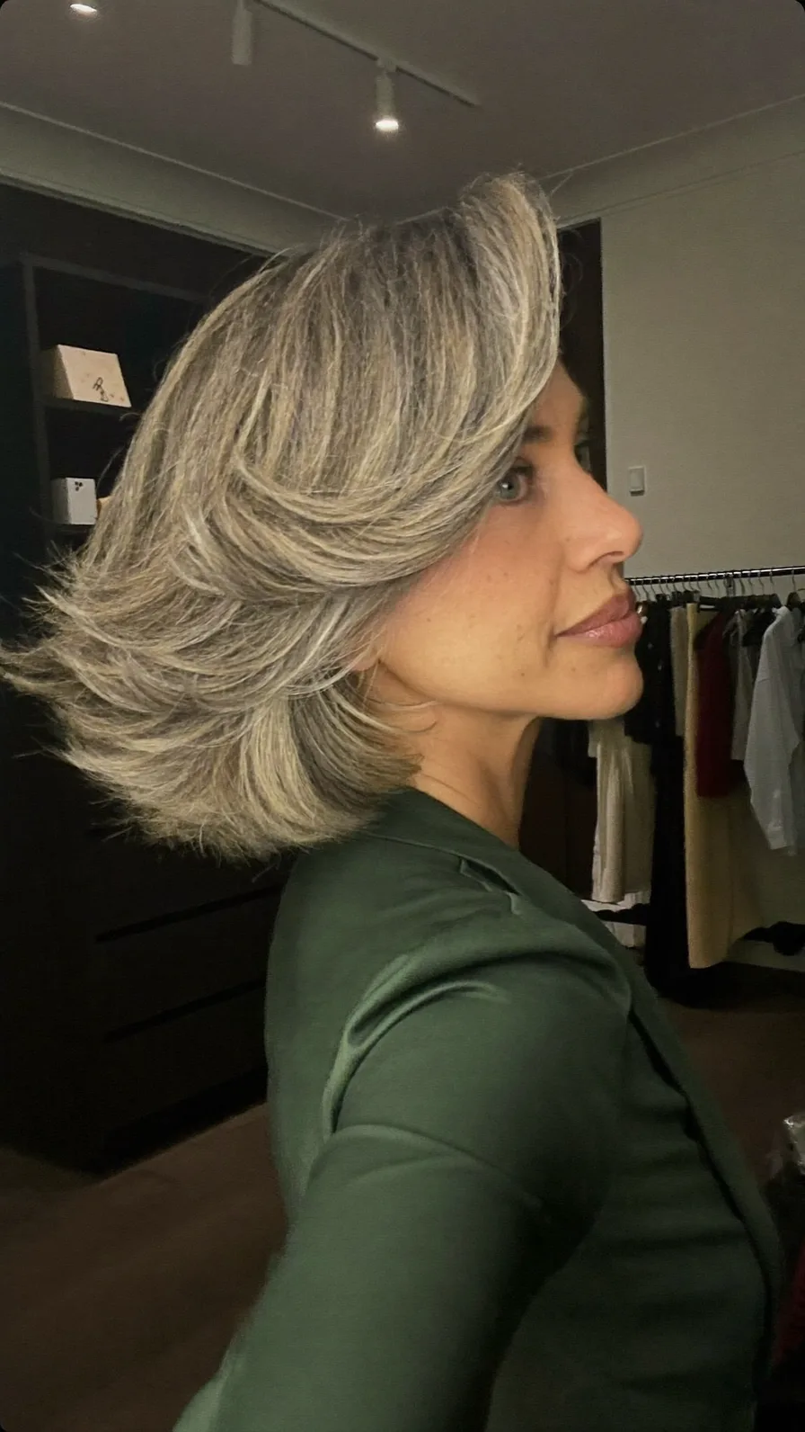 Voluminous Feathered Medium-Length Side-Part Hairstyle with Highlights