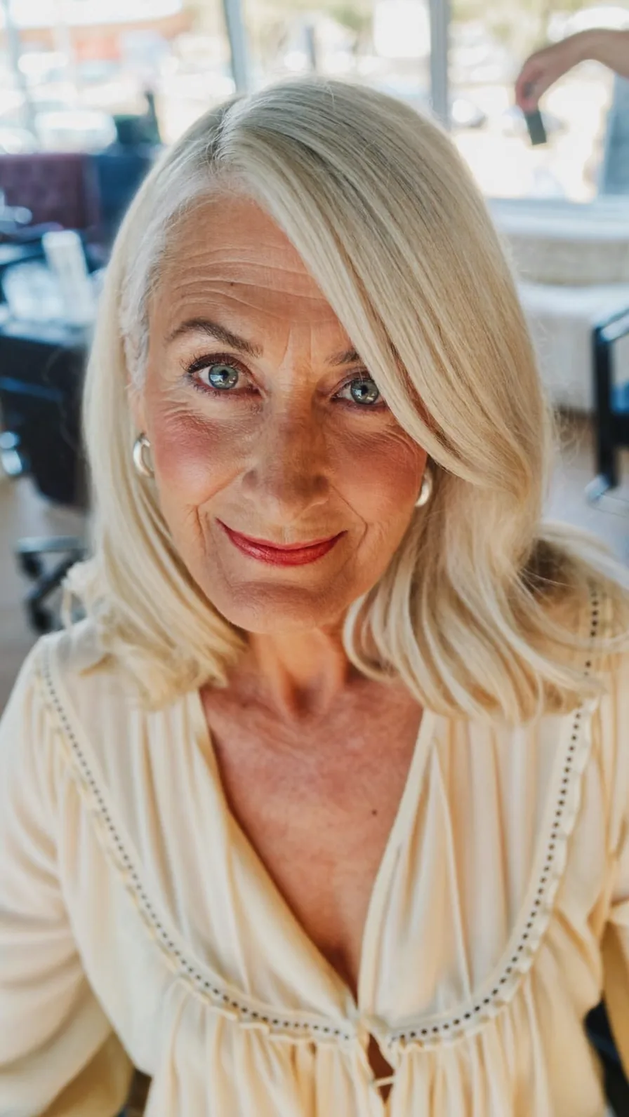 Elegant Shoulder-Length Platinum Blonde with Side-Swept Layers