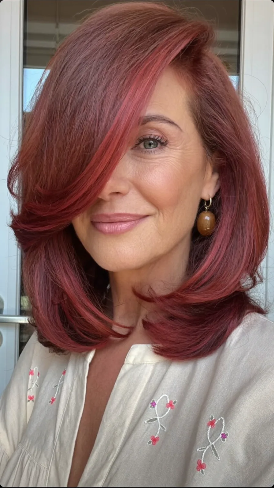 Elegant Shoulder-Length Auburn Hair with Side Swept Layers