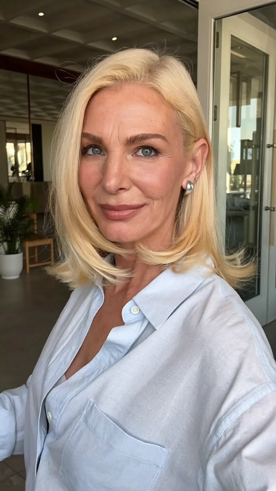 Shoulder-Length Platinum Blonde Long Layers with Flipped Ends
